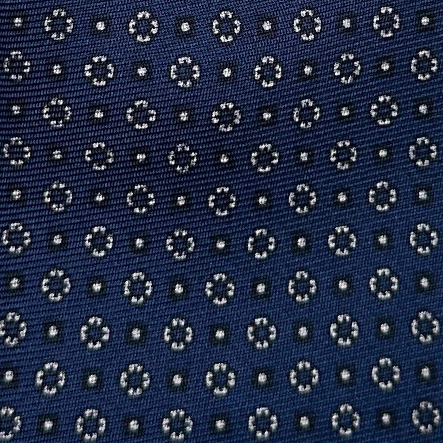 Classic silk tie with blue background and white micro daisy pattern, seven folds silk ties F.Marino Napoli for Wools Boutique Uomo Genève