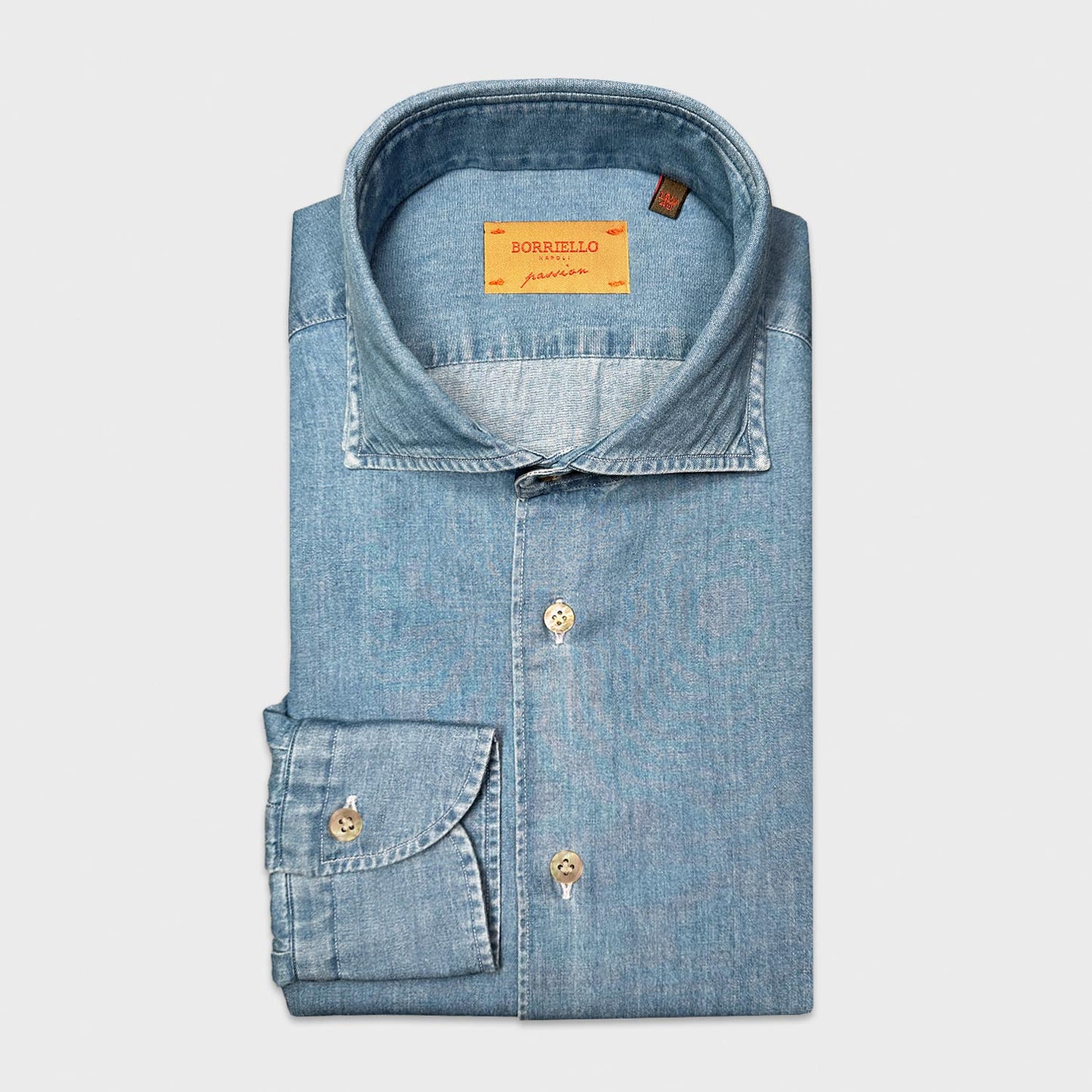 Light Blue Classic Denim Shirt Hand Made in Italy Borriello. Timeless light blue denim shirt, soft to the touch discover on Wools Boutique Uomo Geneva. Chemise en jean pour homme à Genève, fabriquée à la main en Italie.