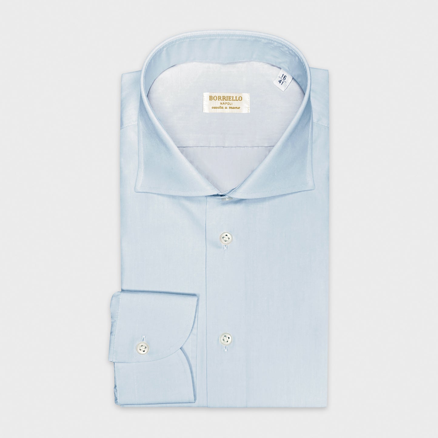 Men's Light Blue Shirt Poplin Cotton For Formal Outfits. Classic light blue shirt essential to alternate with the white shirt , hand made in Italy shirt Borriello Napoli for Wools Boutique Uomo men's store in Geneva
