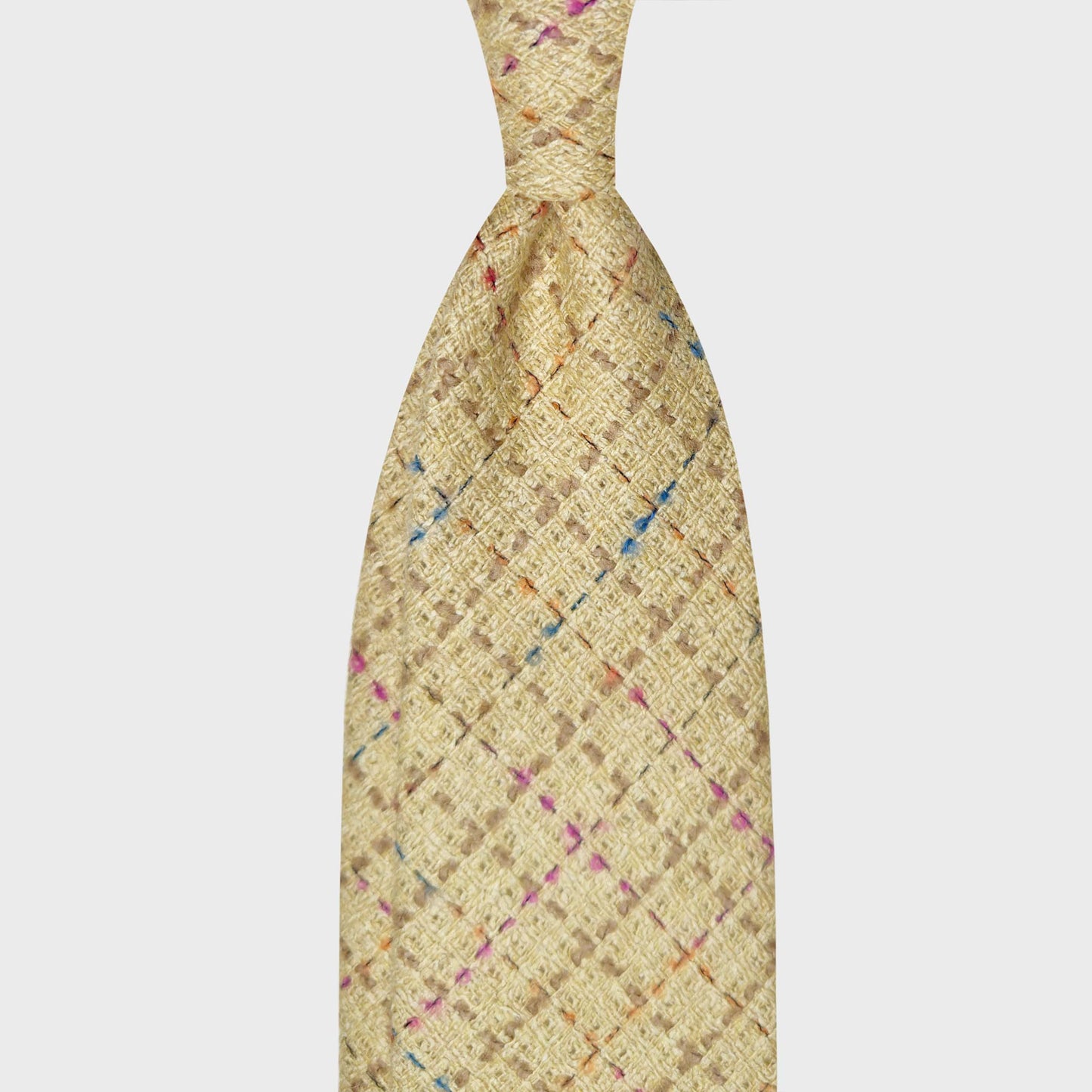 Exclusive Mélange Wool Check Tie Golden Yellow Beige. Refined woven fabric features a crisscross pattern for this wool ties available at men's ties store Geneva Wools Boutique Uomo, elegant and soft touch texture