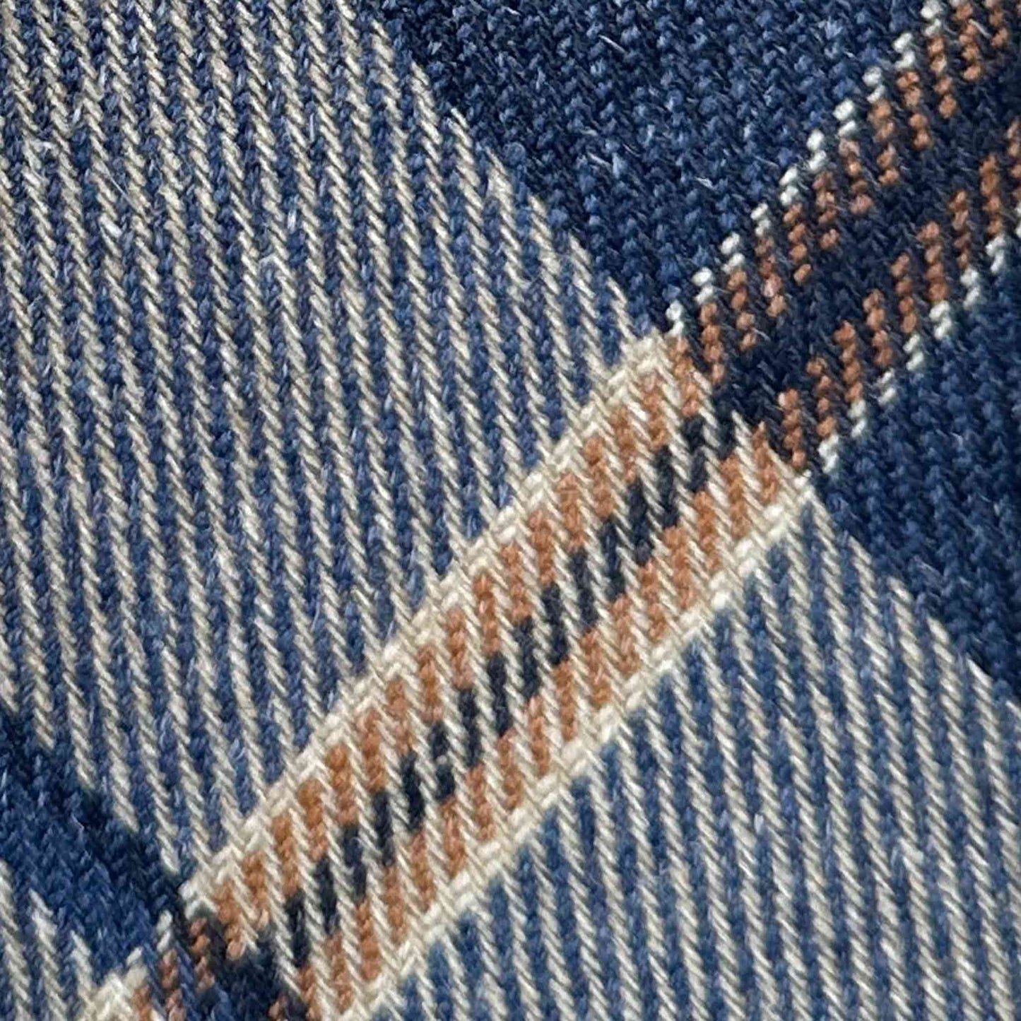 Exclusive wool ties available at men's ties store Geneva Wools Boutique Uomo, denim blue background, ocra and white windowpane pattern