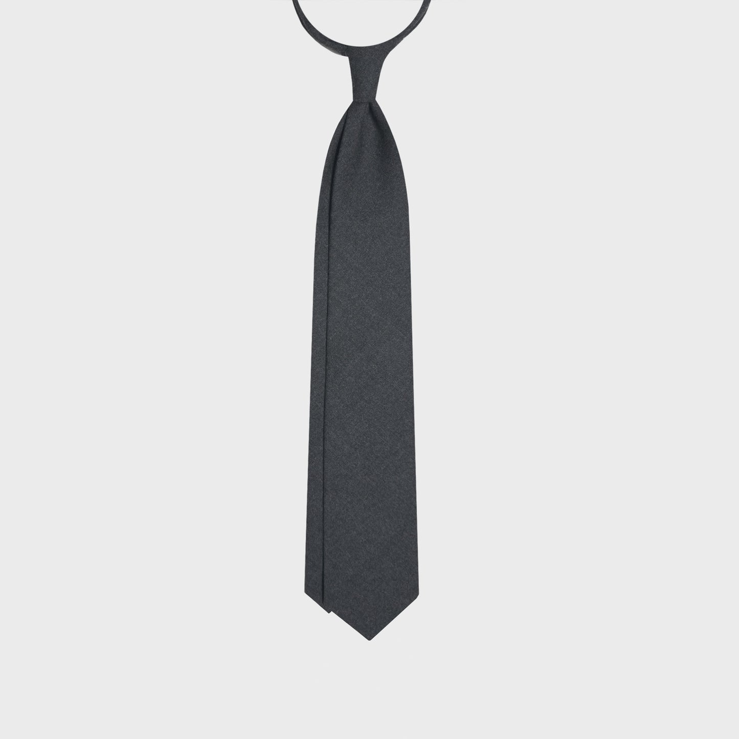 Timeless gray wool tie with classic graphite plain wool tie color, handmade in Italy ties available at men's neckties store Geneva Switzerland