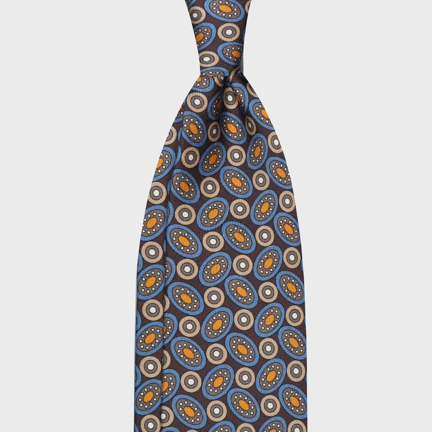 Brown Geometric Planets Fantasy Pattern Silk Tie. Elegant silk tie made with classic geometric planet pattern, coffee brown background, unlined tie 3 folds, handmade tie with a exclusive pattern made by Wools Boutique Uomo