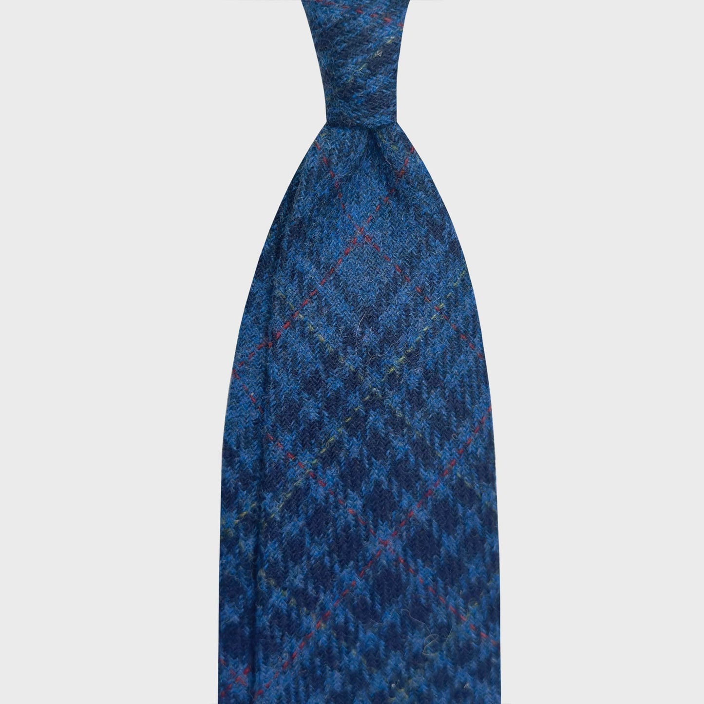 Cobalt Blue Tweed Wool Tie Prince of Wales Hand Made in Italy Refined prince of wales wool tie made with soft tweed wool fabric, cobalt and navy blue clors, discover at Wools Boutique Uomo men's ties store in Geneva
