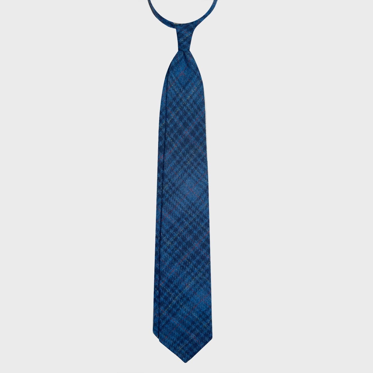 Refined prince of wales wool tie made with soft tweed wool fabric, cobalt and navy blue clors, discover at Wools Boutique Uomo men's ties store in Geneva