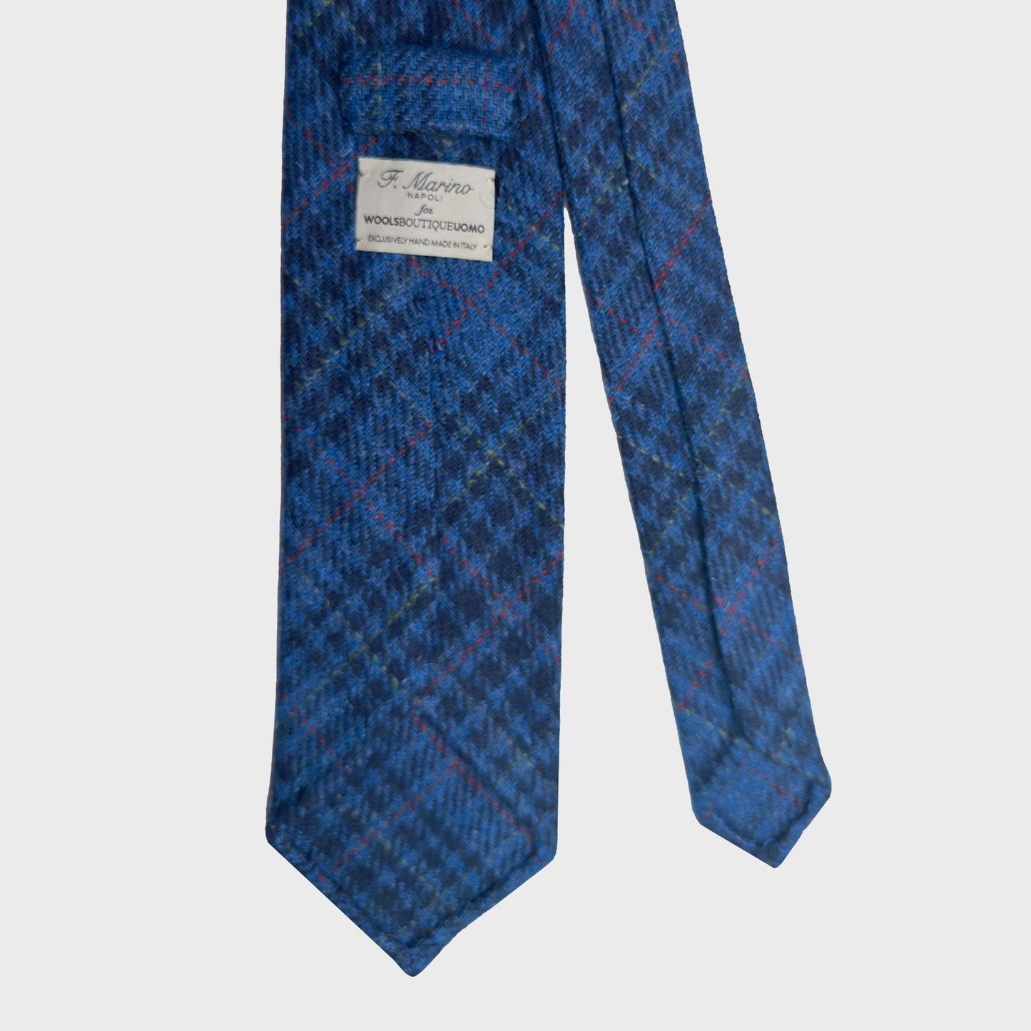 Refined prince of wales wool tie made with soft tweed wool fabric, cobalt and navy blue clors, discover at Wools Boutique Uomo men's ties store in Geneva