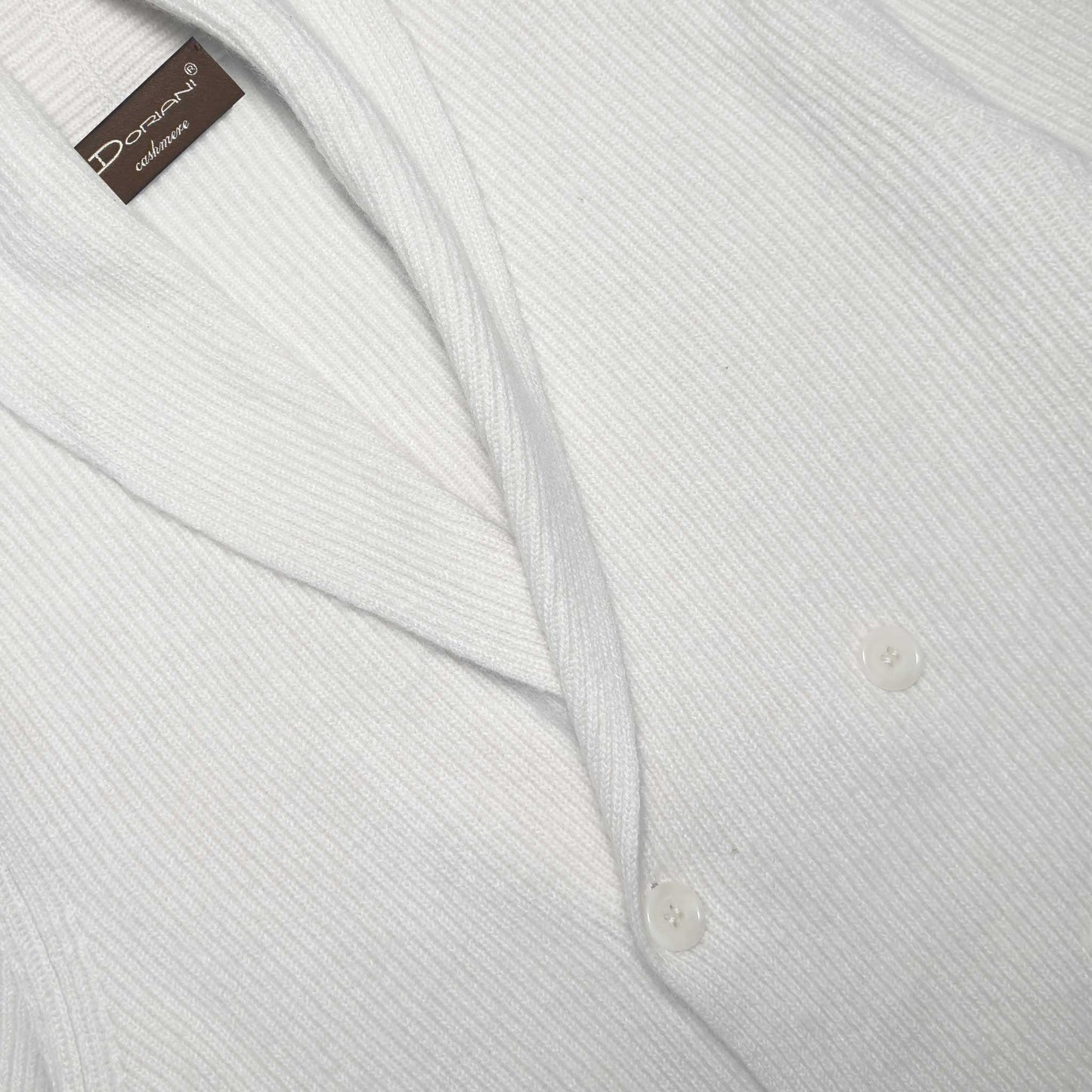 White Double Breasted Cardigan Sweater Shawl Collar Cashmere. Cashmere cardigan sweater shawl collar in Geneva, made in Italy by Doriani with highest quality cashmere, ideal to wear with a shirt and tie or a basic crewneck