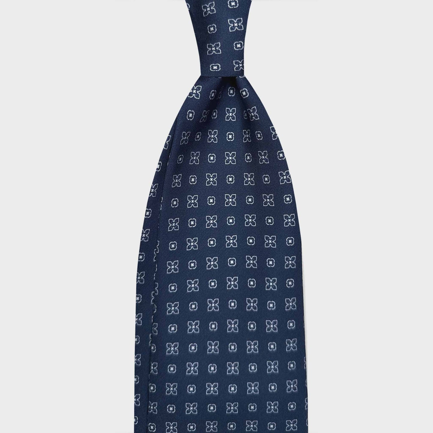 Shop Men's Blue Silk Tie Classic Geometric Fantasy Pattern. Tailoring indigo blue silk tie, white oval geometric pattern, sartorial blue ties f marino napoli for Wools Boutique Uomo Geneva