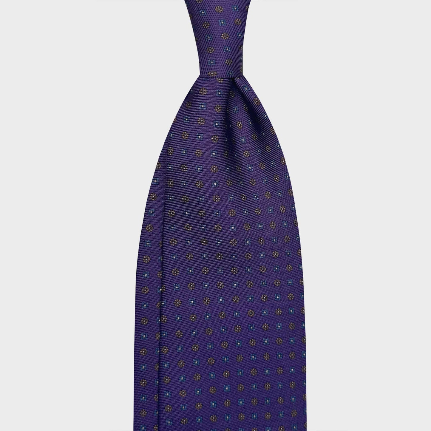 Violet Silk Tie 7 Folds Classic Micro Daisy. Elegant violet silk tie with cobalt blue and soft brown micro daisy, madder seven folds silk ties F.Marino Napoli for Wools Boutique Uomo Genève