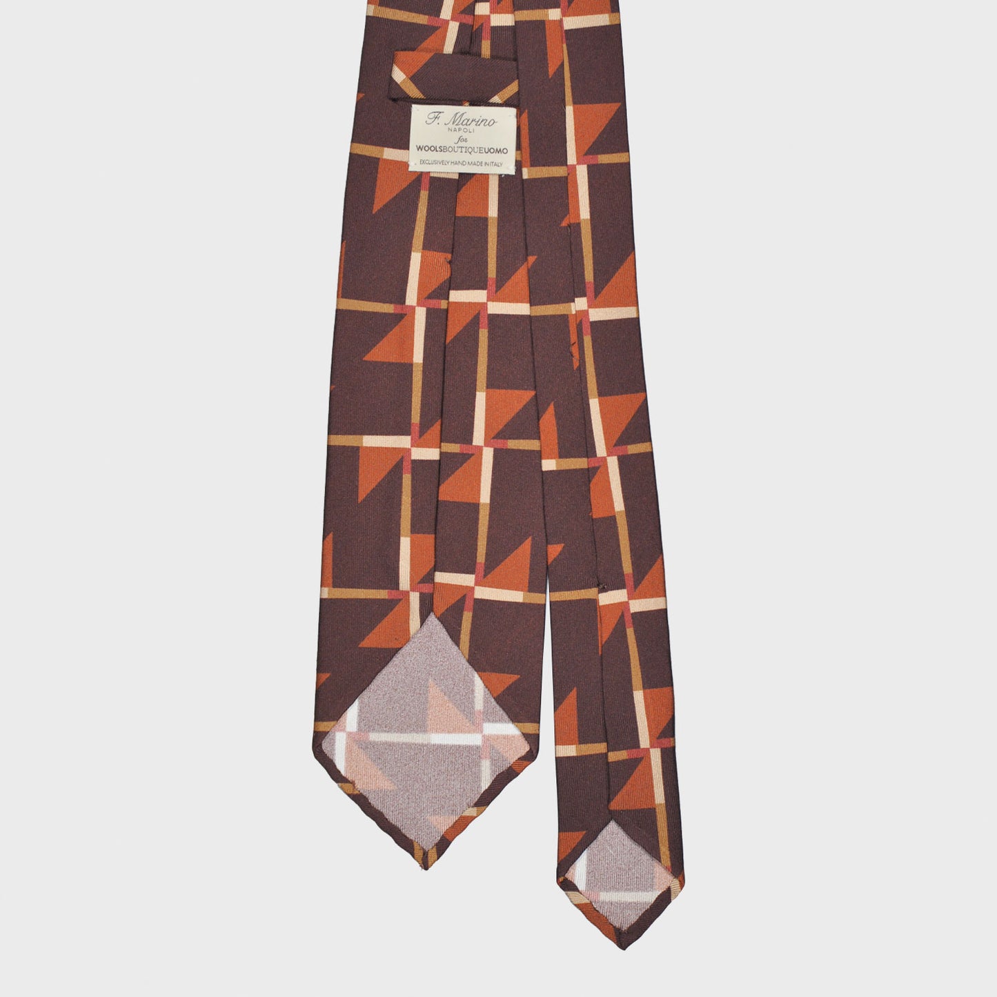 Refined deco tie made with finest Italian silk soft to the touch, coffee brown background with orange and ocra Art Decò pattern, unlined tie 3 folds, this Art Deco ties is a exclusive pattern made by Wools Boutique Uomo