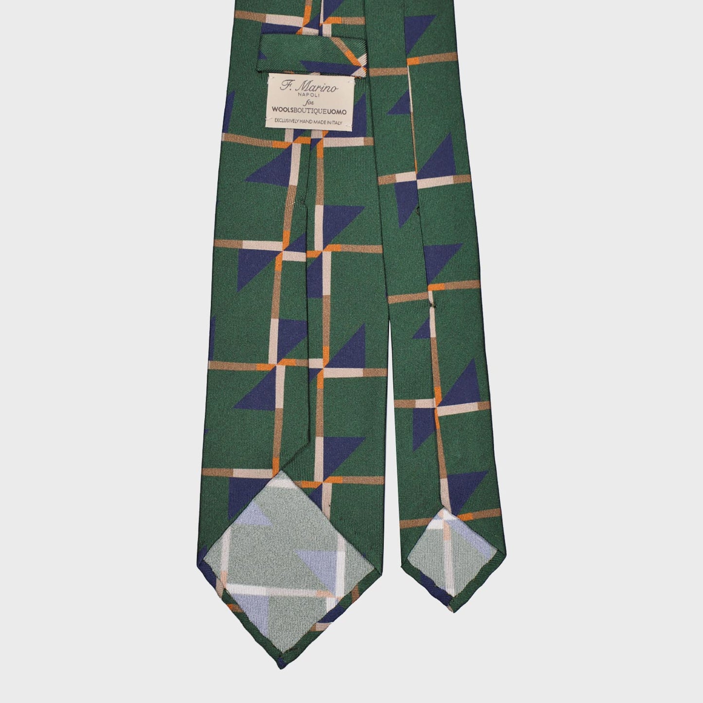 Refined deco tie made with finest Italian silk soft to the touch, grass green background with cobalt blue and beige Art Decò pattern, unlined tie 3 folds, this Art Deco ties is made with a exclusive pattern made by Wools Boutique Uomo