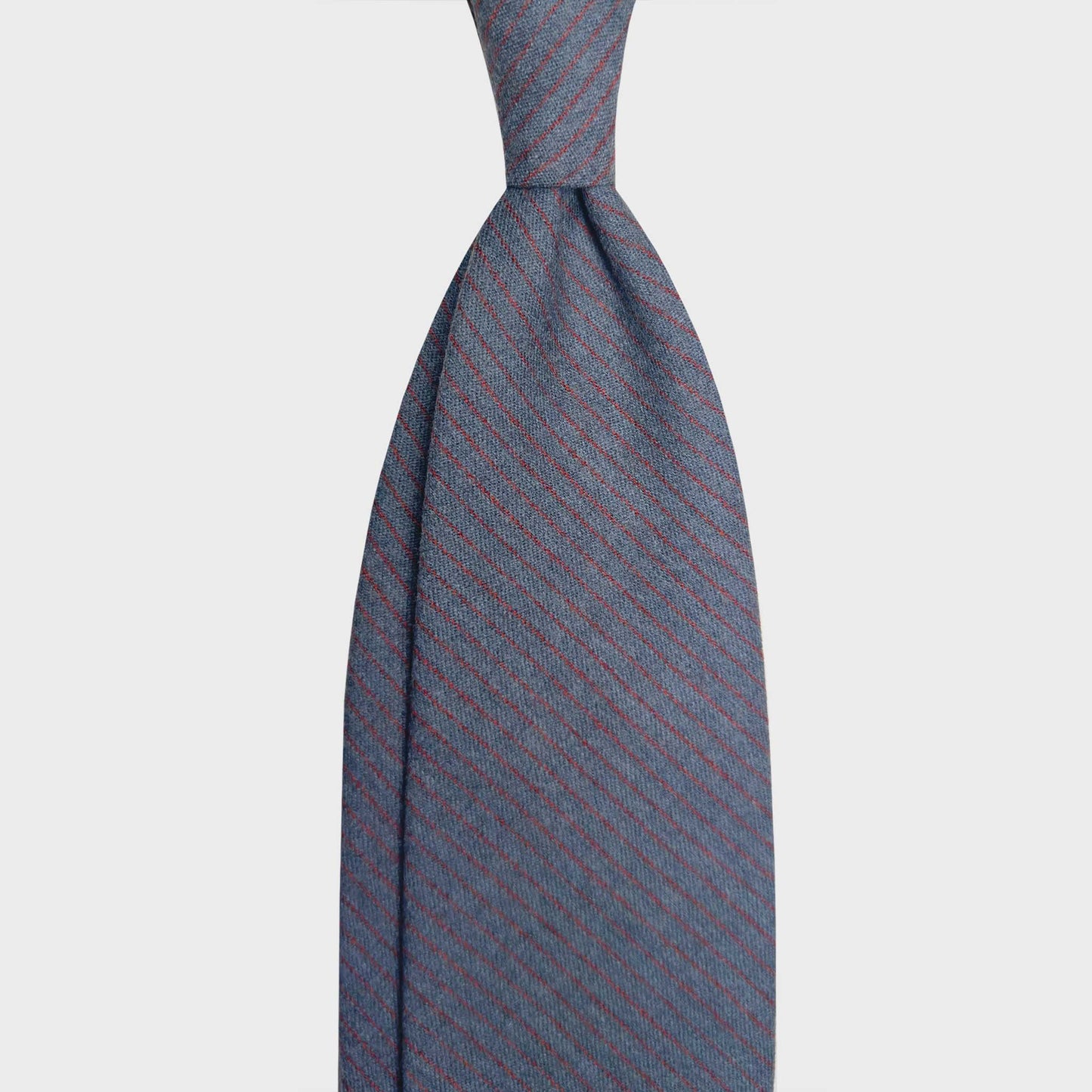 Steel Grey Wool Tie Classic Burgundy Striped Shop Now. Refined gray wool ties available at men's ties store Geneva Wools Boutique Uomo, elegant and soft touch texture, steel grey and burgundy red striped