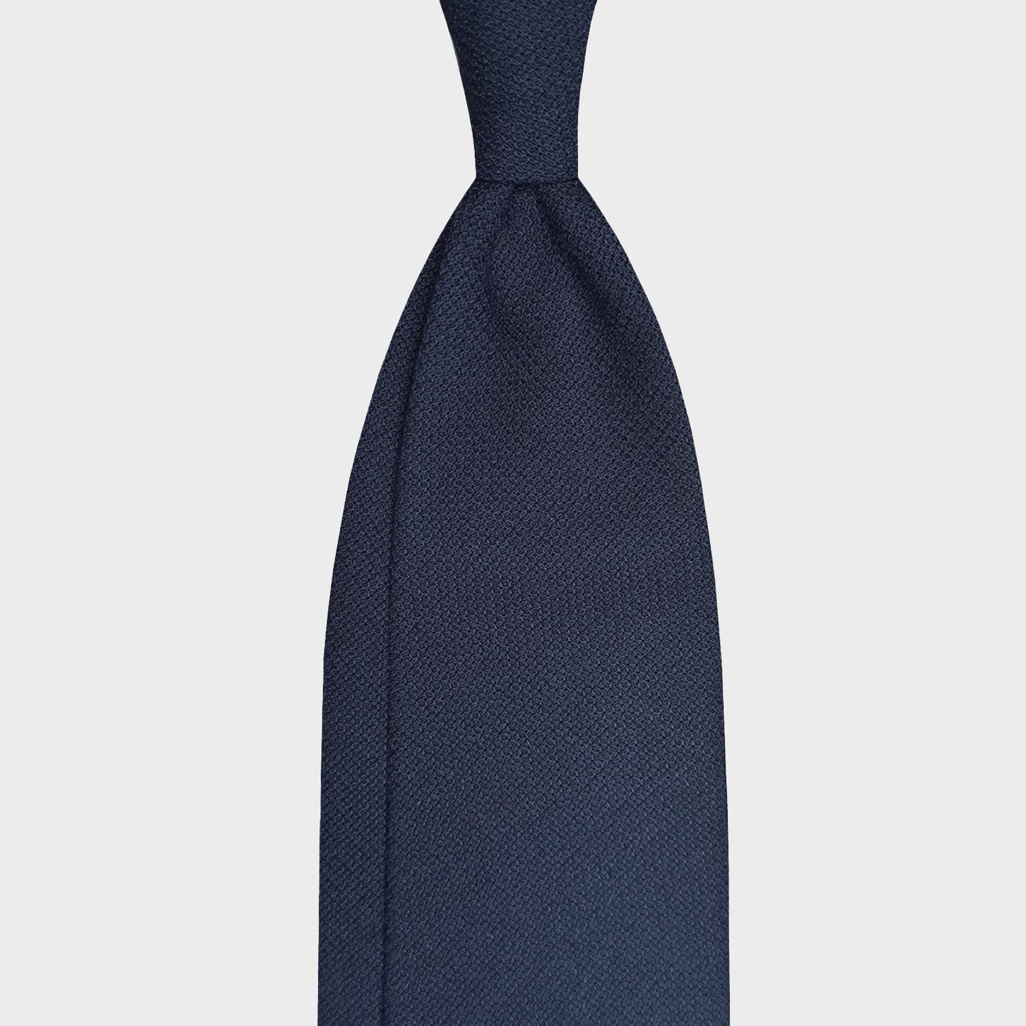 Navy Blue Wool Tie Hopsack Plain Color Shop Now. Classic wool tie made with soft hopsack wool, navy blue plain color, handmade Italian tie collection Wools Boutique Uomo magasin homme geneve