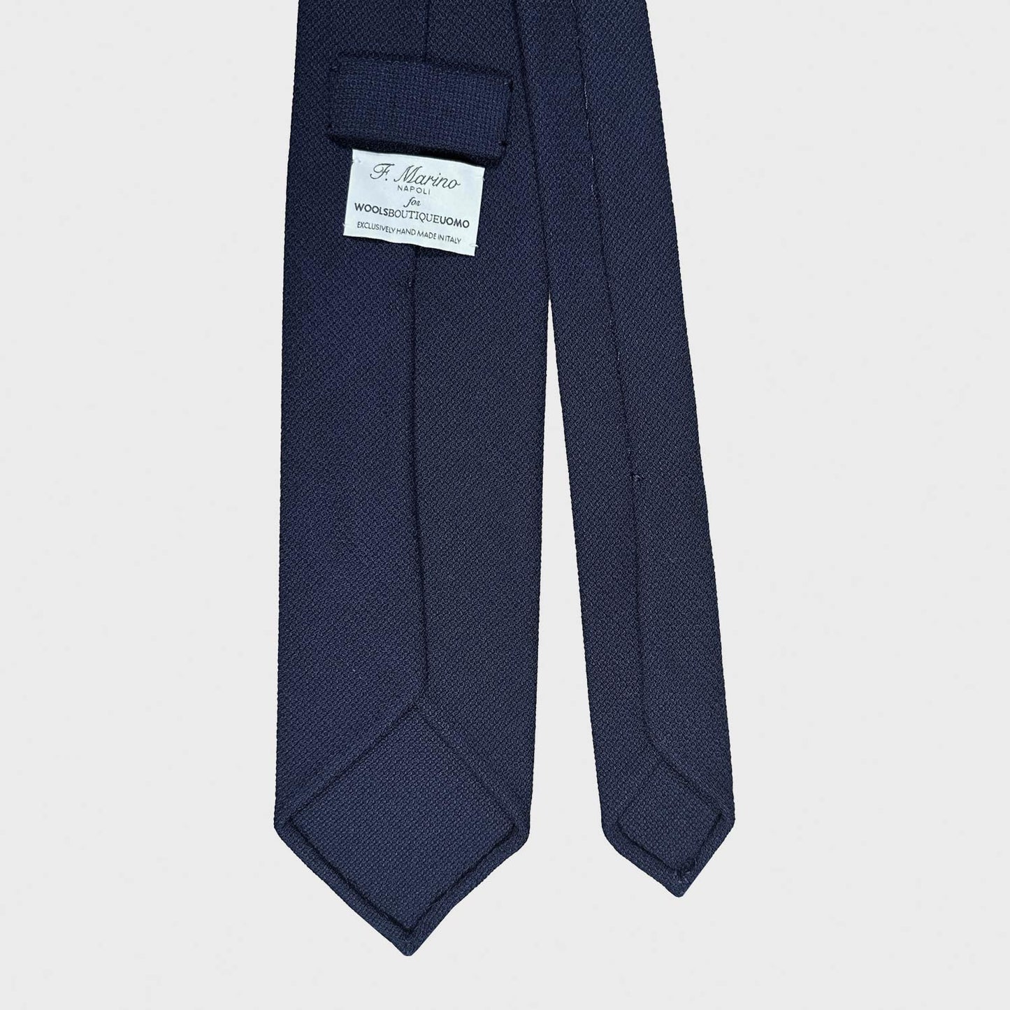 Navy Blue Wool Tie Hopsack Plain Color Shop Now. Classic wool tie made with soft hopsack wool, navy blue plain color, handmade Italian tie collection Wools Boutique Uomo magasin homme geneve