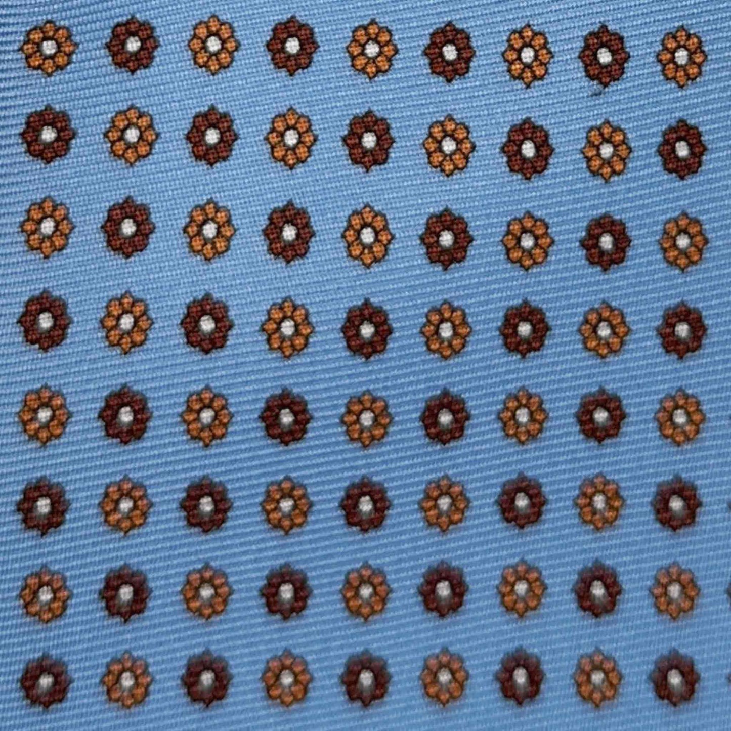 Hand made light blue silk tie, coffee and rust brown daisy pattern, made in Italy sartorial ties f marino napoli for Wools Boutique Uomo Genève