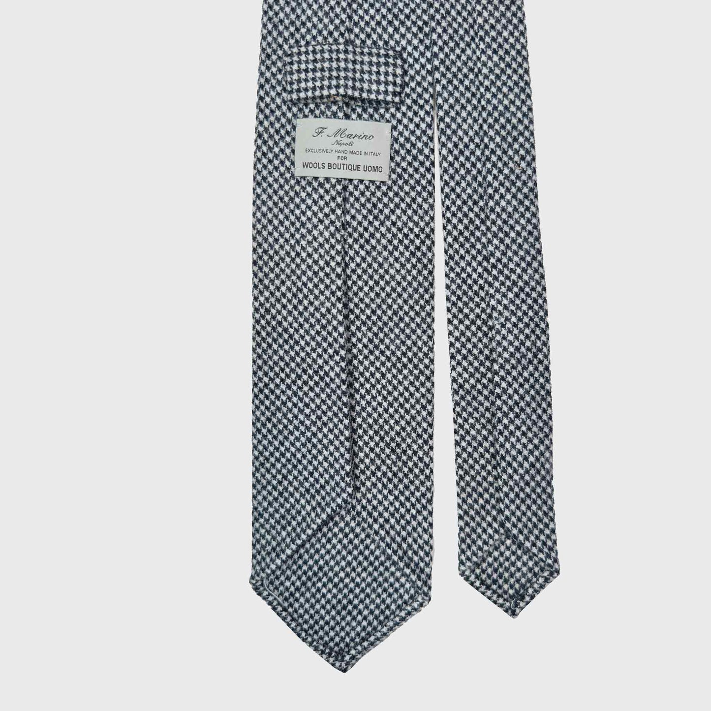 Timeless black white pied-de-poule wool tie, unlined ties handmade in Italy ties available at men's neckties store Geneva Switzerland