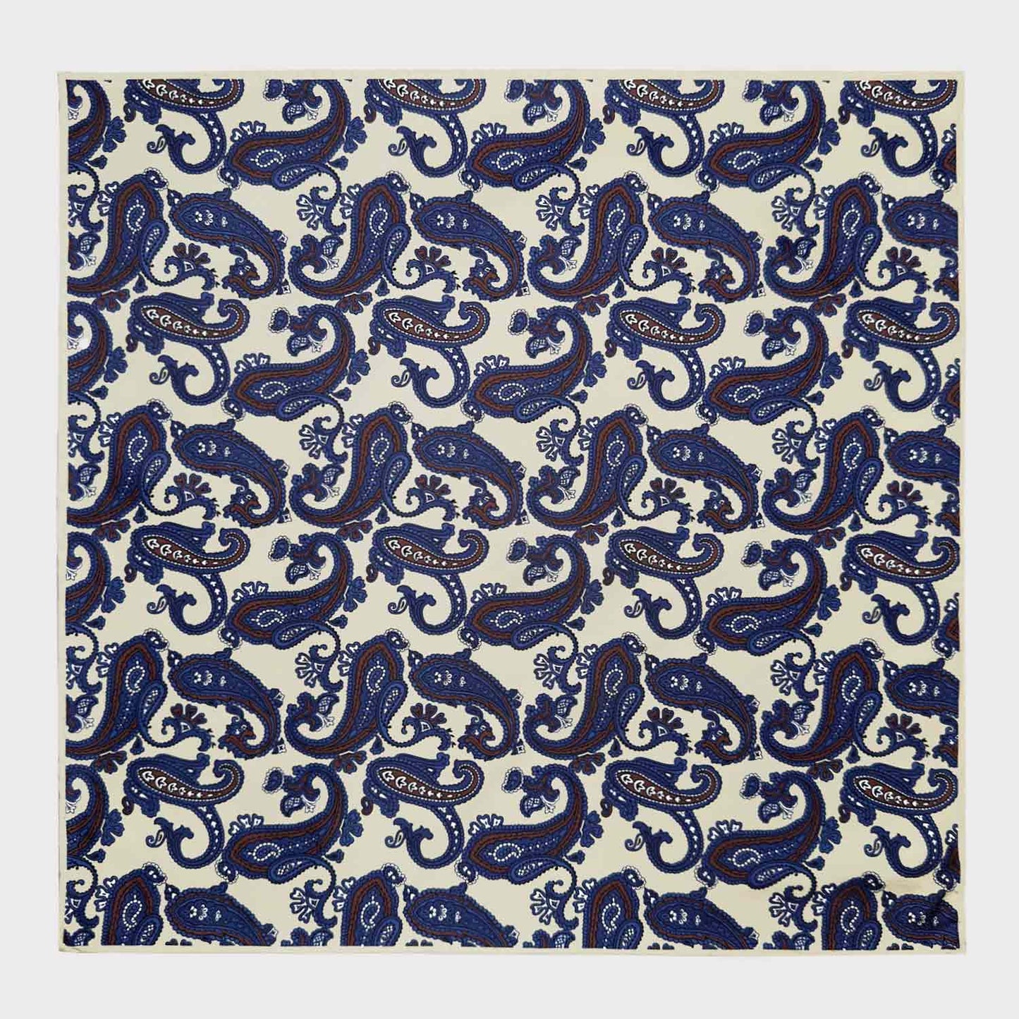 Ivory White Silk Pocket Square Paisley Pattern. Men's paisley pocket square made with soft silk and with rolled edge, ivory white background with coffee brown and denim blue paisley pattern, ideal for a refined men's outfit