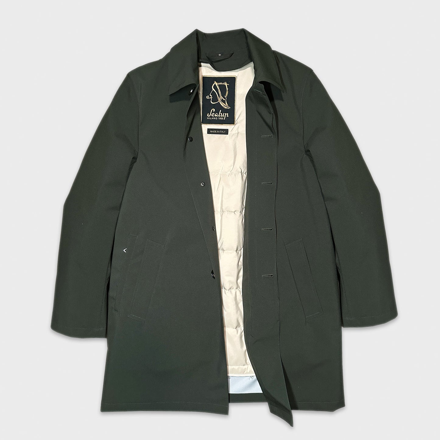Loden Green Raincoat Sealup Removable Padded Interior. Men's green raincoat with removable padded interior, made in Italy by Sealup with soft polyester waterproof fabric, discover in Wools Boutique Uomo Geneva