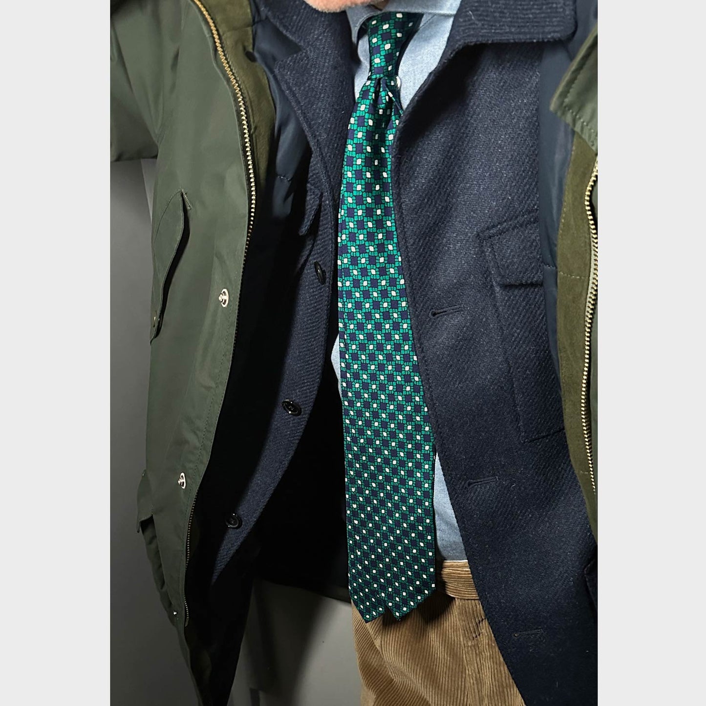 Elegant silk tie with refined vintage pattern, hand made in Italy, 3 folds, hand rolled edge, untipped, cobalt blue background with emerald green and white pattern.