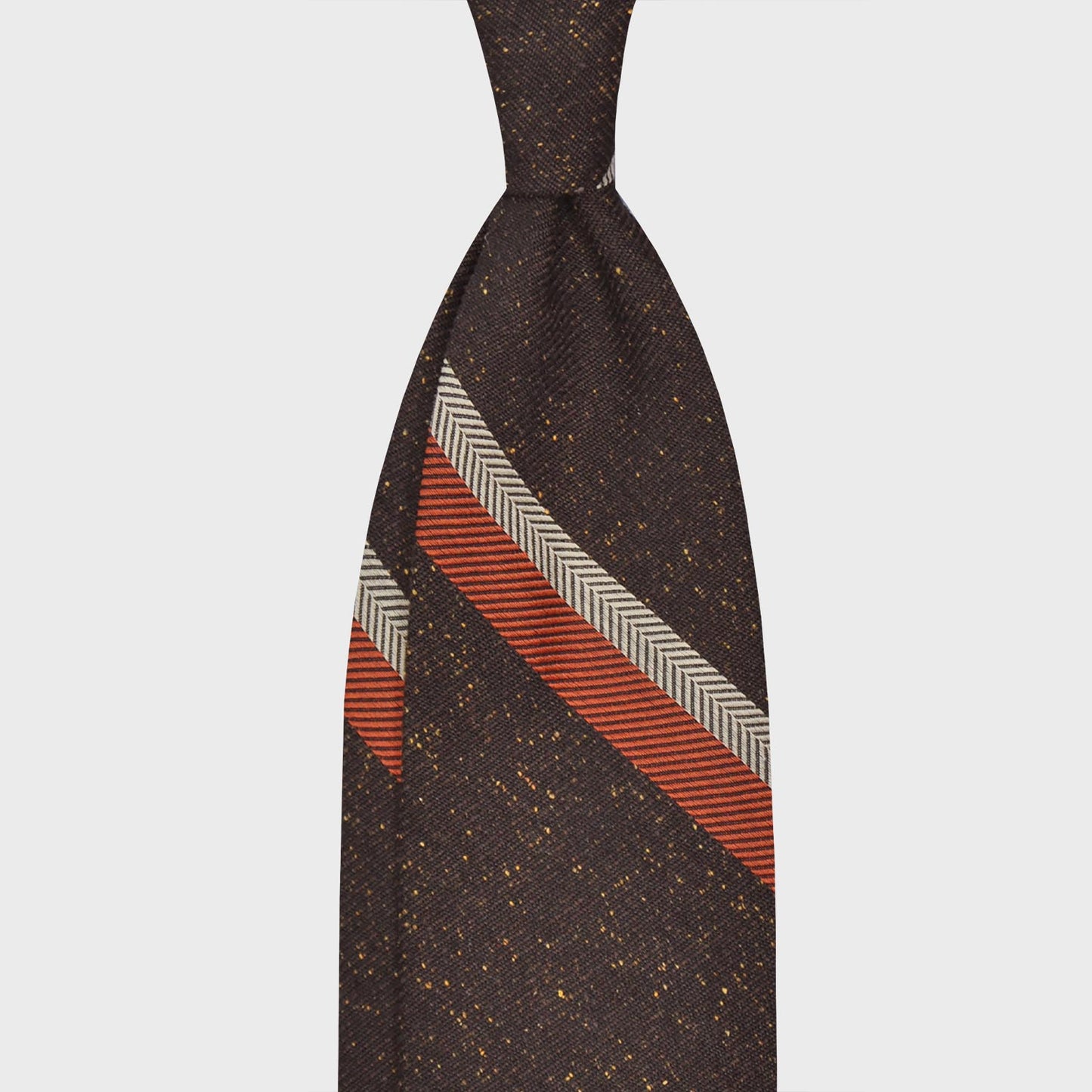Donegal Brown Silk Wool Striped Tie. Refined regimental grenadine necktie made with silk and wool, hand rolled edge, unlined 3 folds, dark brown and yellow dots background donegal pattern, silver grey and orange striped, F.Marino Napoli exclusive for Wools Boutique Uomo