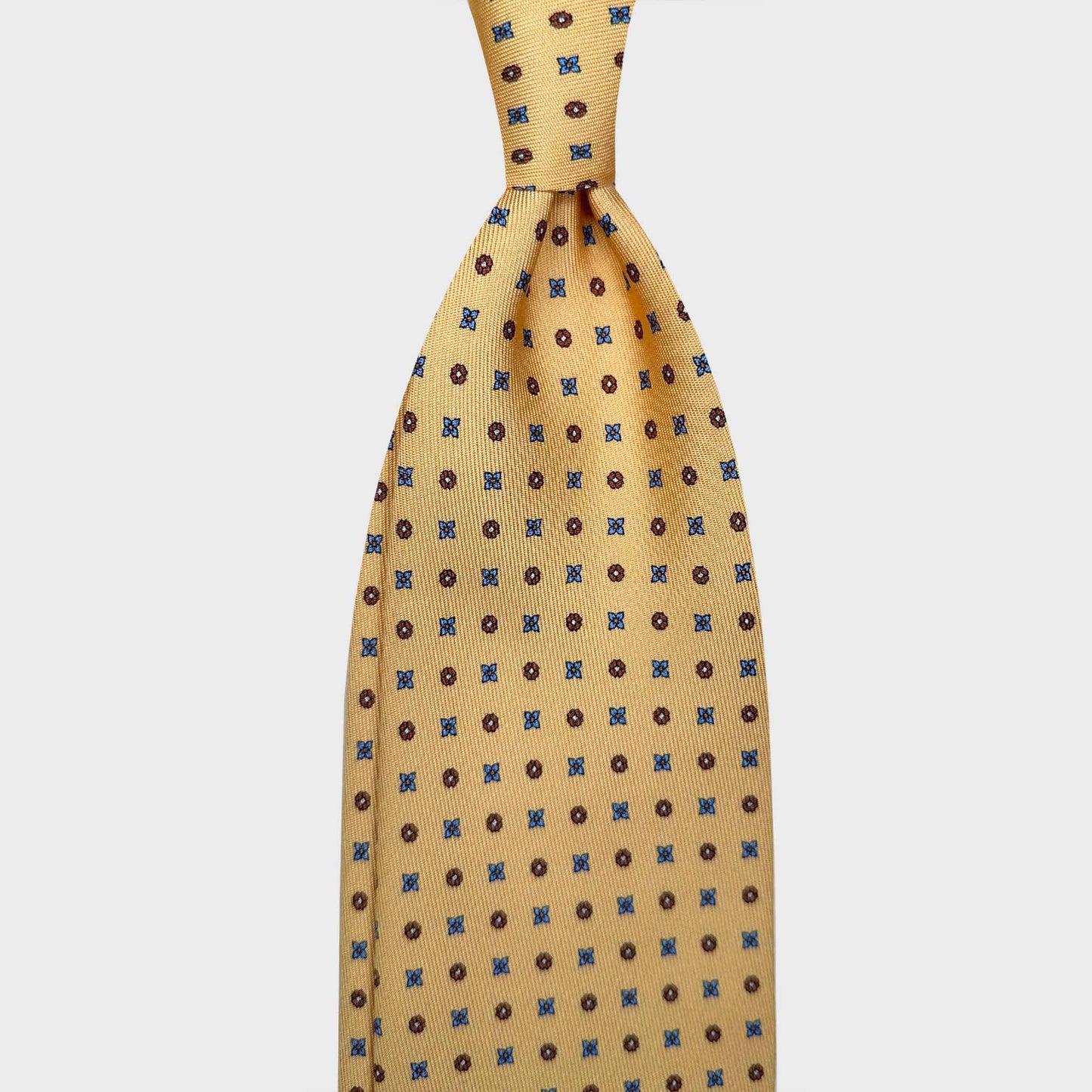 Shop Men's Yellow Silk Tie Classic Diamonds Pattern. Hand made yellow silk tie, brown and light blue diamonds pattern, made in Italy sartorial ties f marino napoli for Wools Boutique Uomo Genève