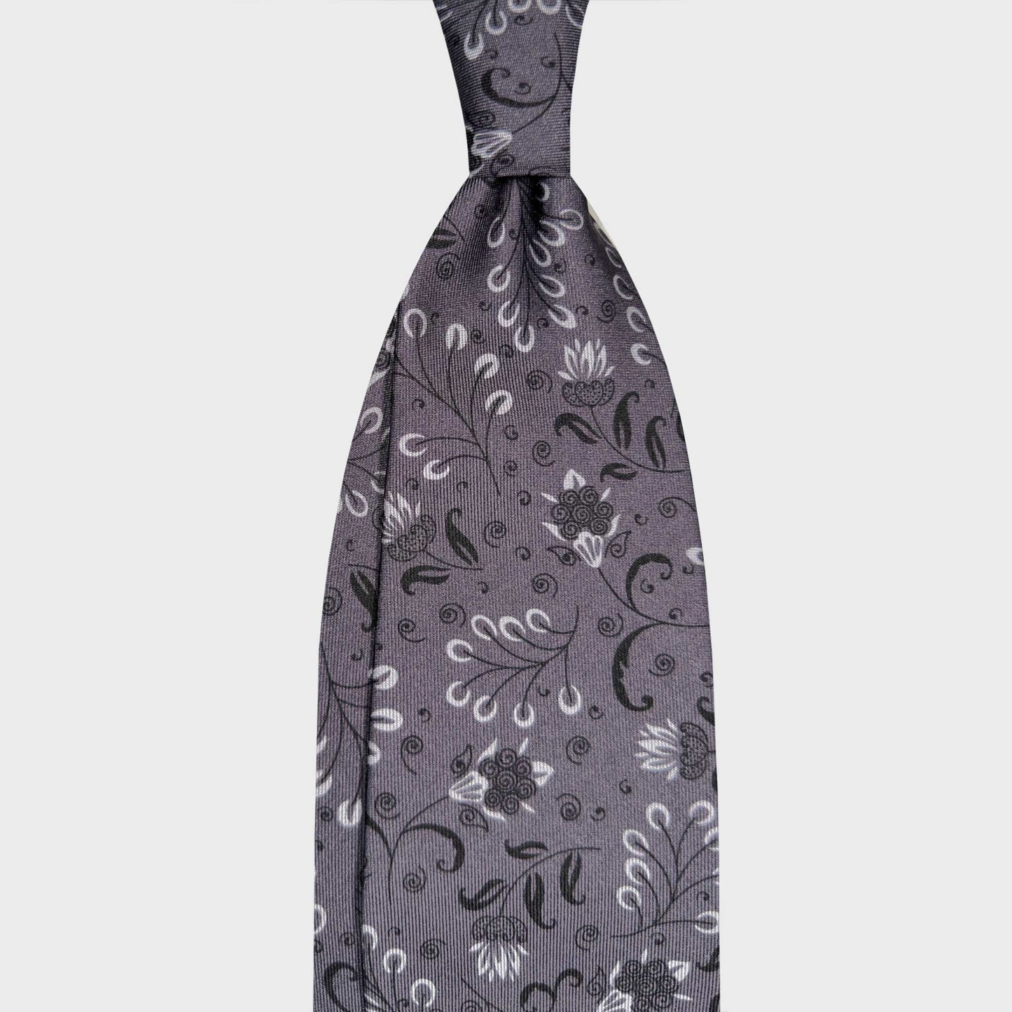 Anthracite Grey Liberty Silk Tie Wools Boutique Uomo Geneva. Elegant anthracite grey silk tie with a refined Liberty inspired botanical pattern. A sophisticated accessory for timeless tailoring and formal wear.