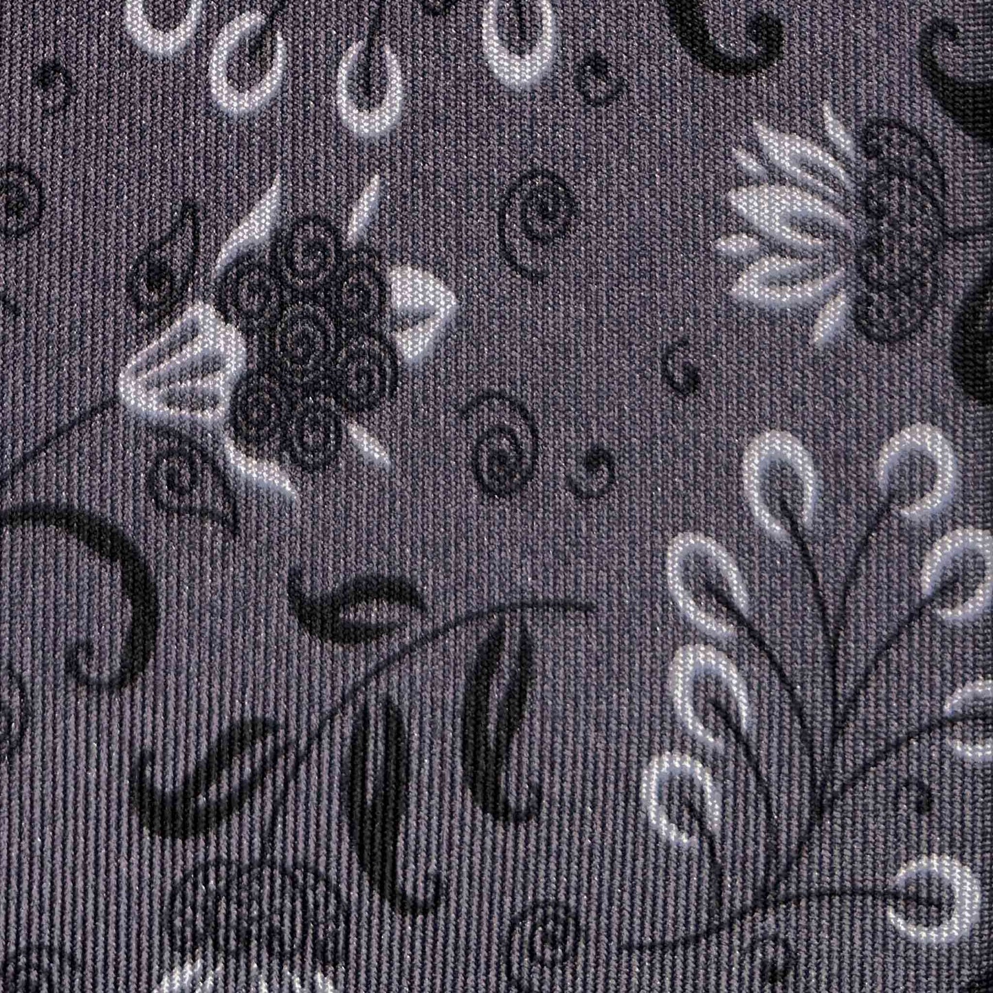 Detail of Liberty floral and botanical pattern on anthracite grey silk tie
