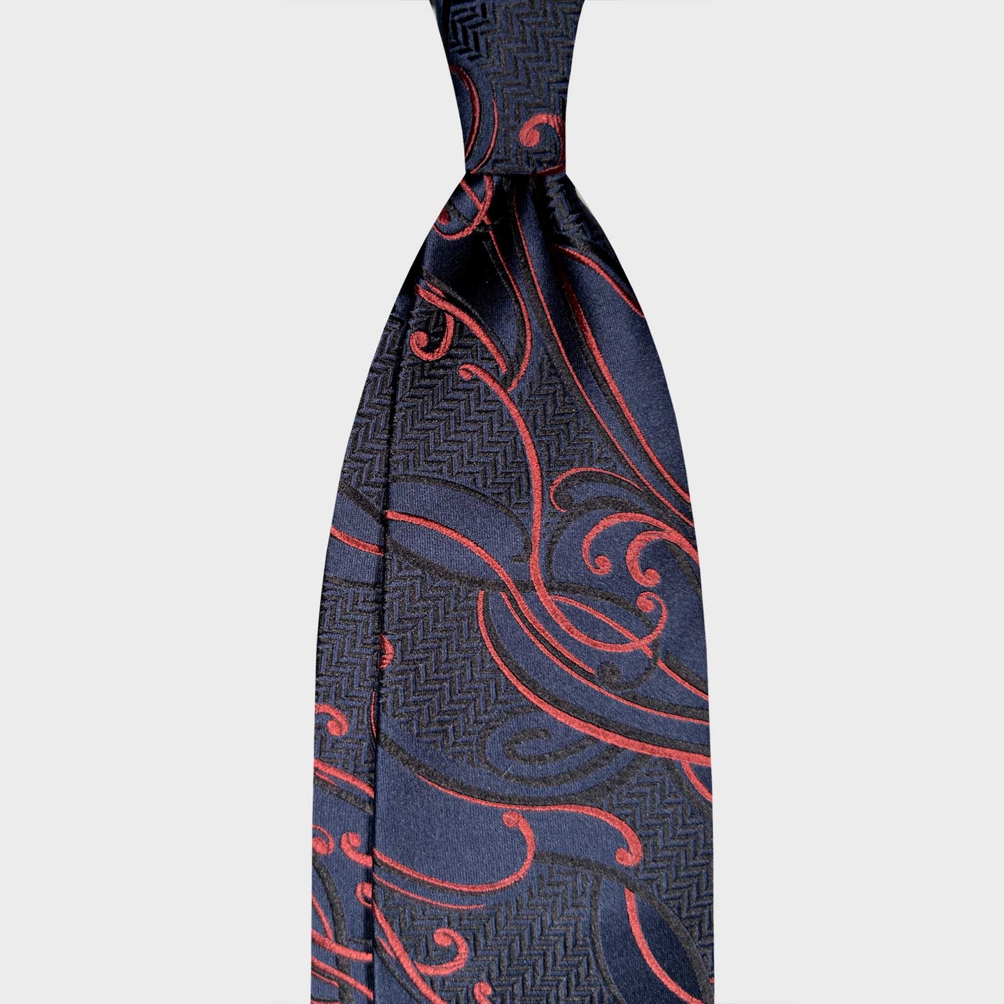 Art Nouveau Silk Tie Ornament Botanic Pattern Navy Blue. Exclusive art Nouveau silk tie with ornamental botanical pattern in navy blue and coral red. Handmade in Italy and selected by Wools Boutique Uomo Geneva.