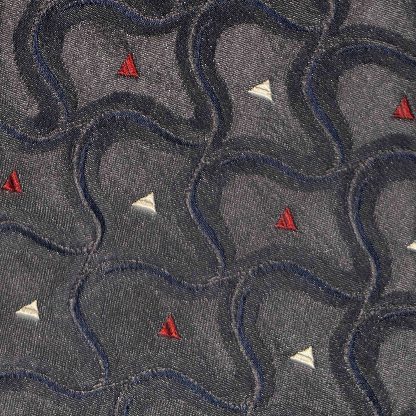 Steel grey silk tie with geometric wave pattern navy blue ivory and ruby red detail