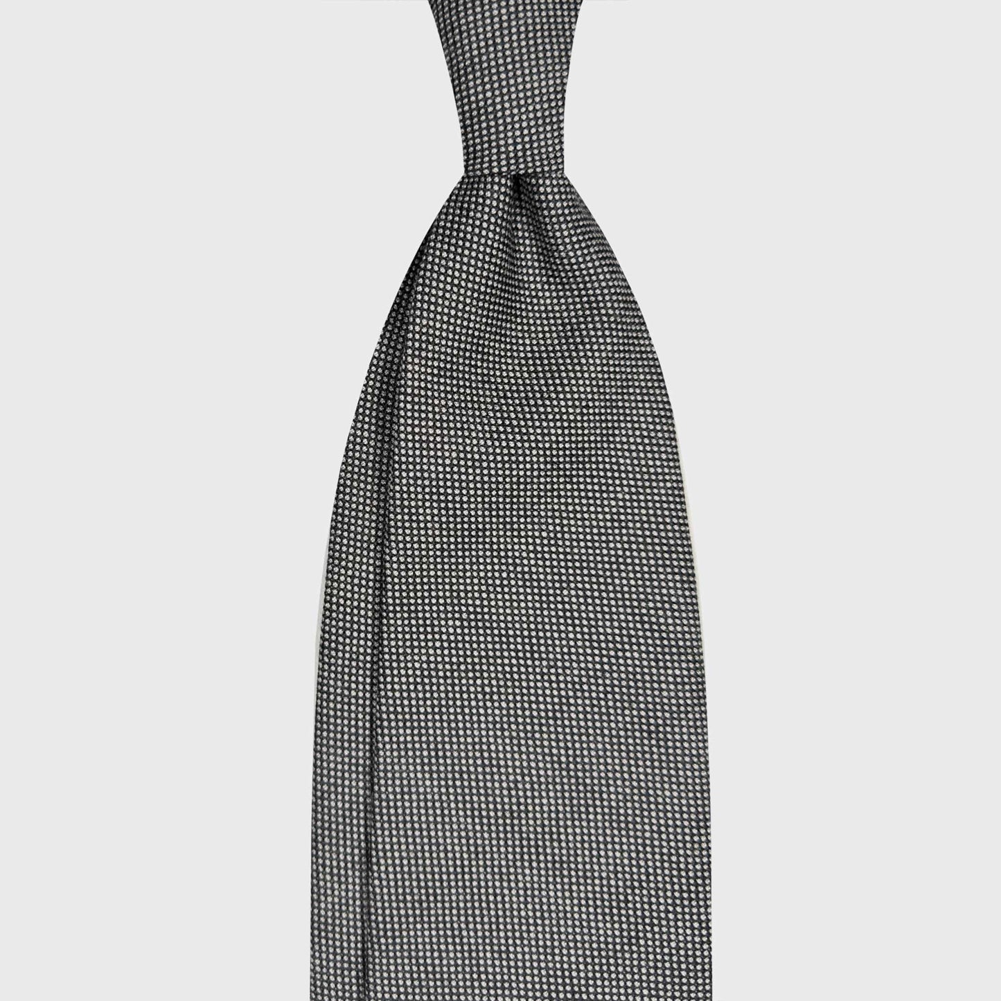 Smoke Grey Birdseye Wool Tie Handmade in Italy. Refined smoke grey birdseye wool tie handmade in Italy by Wools Boutique Uomo Geneva. A sophisticated textured tie for sartorial business outfits.