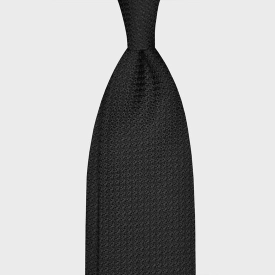 Load image into Gallery viewer, Black Silk Tie Grenadine Chunky Gauze. Classic black silk tie made with refined grenadine silk chunky gauze, unlined hand rolled edge, F.Marino Napoli exclusive for Wools Boutique Uomo. Ideal for formal black tie outfits to wear in the four seasons.
