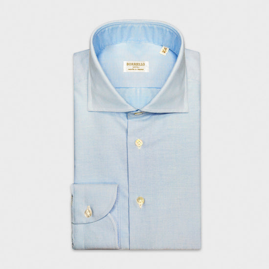 Light Blue Oxford Cotton Shirt Borriello Napoli. Classic handmade shirt ideal for the office and for more formal occasions, made in soft and refined oxford cotton double twisted, light blue color, handmade buttonholes, mother of pearl buttons.