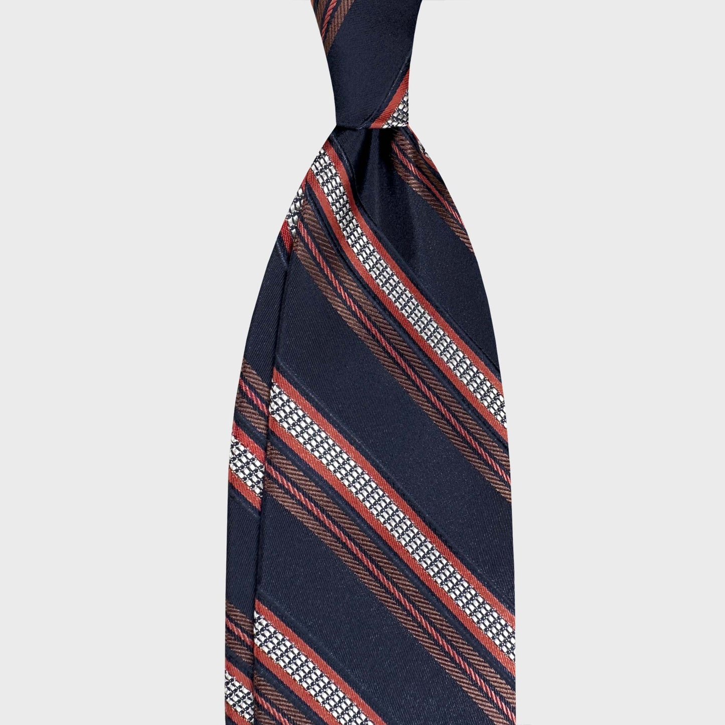 Handmade F.Marino jacquard silk regimental tie in navy blue with red lobster and silver stripes. Crafted in Naples for Wools Boutique Uomo Geneva.