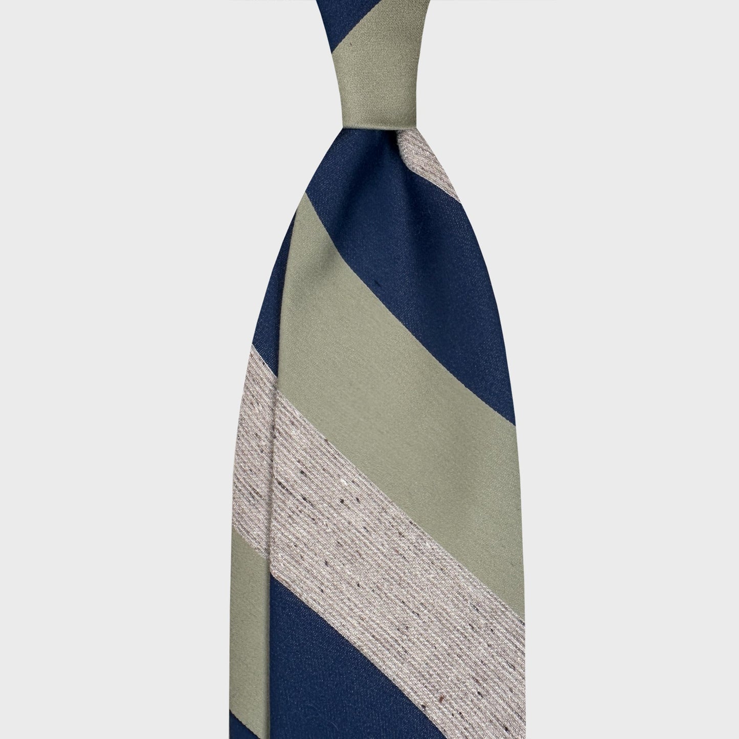 Handmade F.Marino silk tie with large regimental stripes in navy blue, pistachio green and beige mélange. Crafted in Naples for Wools Boutique Uomo Geneva.