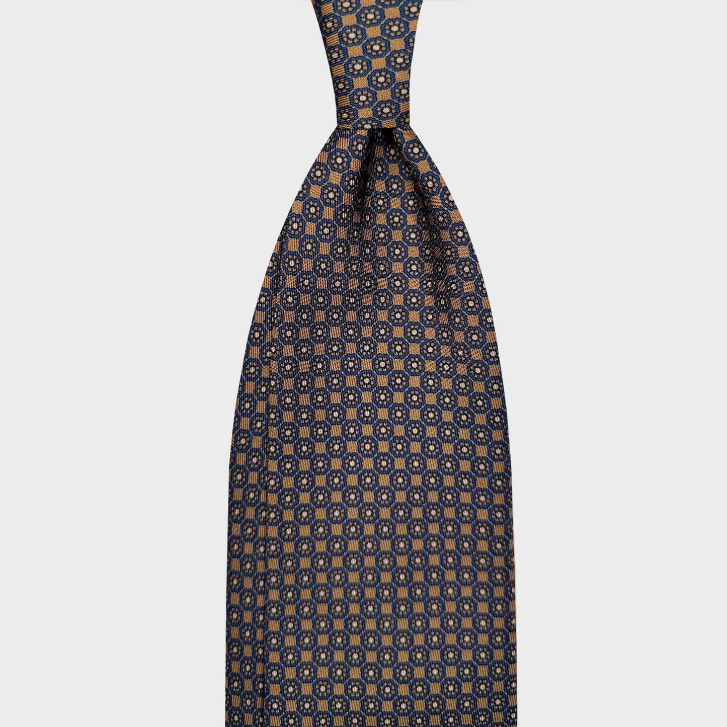 Bronze Tie For Men Classic Octagon Pattern. Hand made bronze brown silk tie, navy blue octagon with daisy pattern, made in Italy sartorial ties f marino napoli for Wools Boutique Uomo Genève