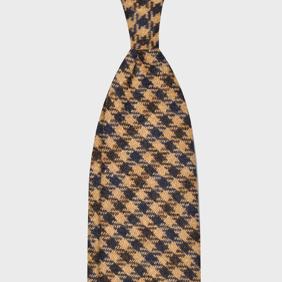 Camel Tweed Tie Classic Checked. Classic tweed tie, wool texture to the touch bristly feeling, unlined checked wool tie handmade in Italy by F.Marino Napoli exclusive for Wools Boutique Uomo, camel tobacco background, denim blue and coffee brown checked pattern.