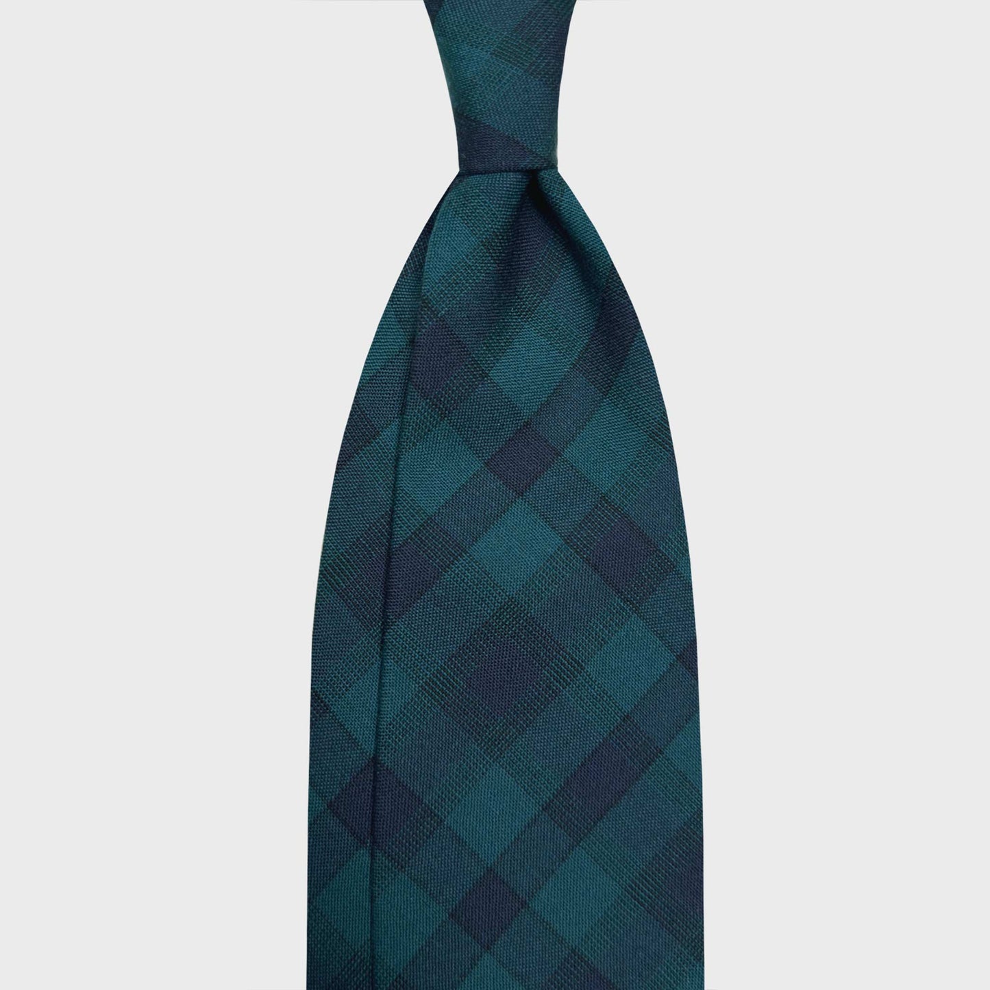 Shop Now The Exclusive Every Seasons Wool Tie Green Checked. Exclusive wool tie green checked made in Italy with light wool extra fine, discover collection of classic ties for every seasons at the men's tie shop in Geneva