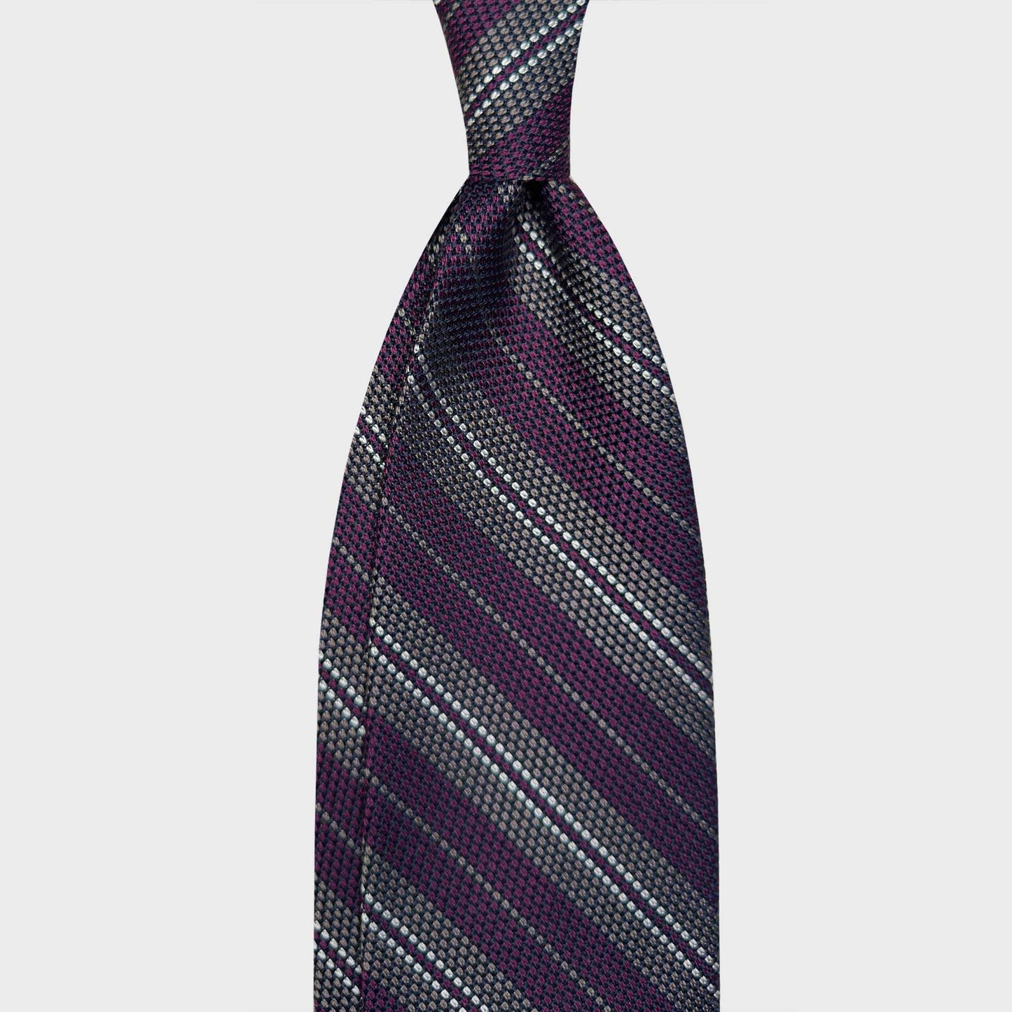Purple Plum Regimental Multi Striped Silk Tie Grenadine Small Gauze. Refined grenadine silk tie small gauze, purple plum background, smoke grey and white multi striped ties, magasin de cravates pour hommes à Genève. F.Marino Napoli exclusive hand made in Italy ties for Wools Boutique Uomo