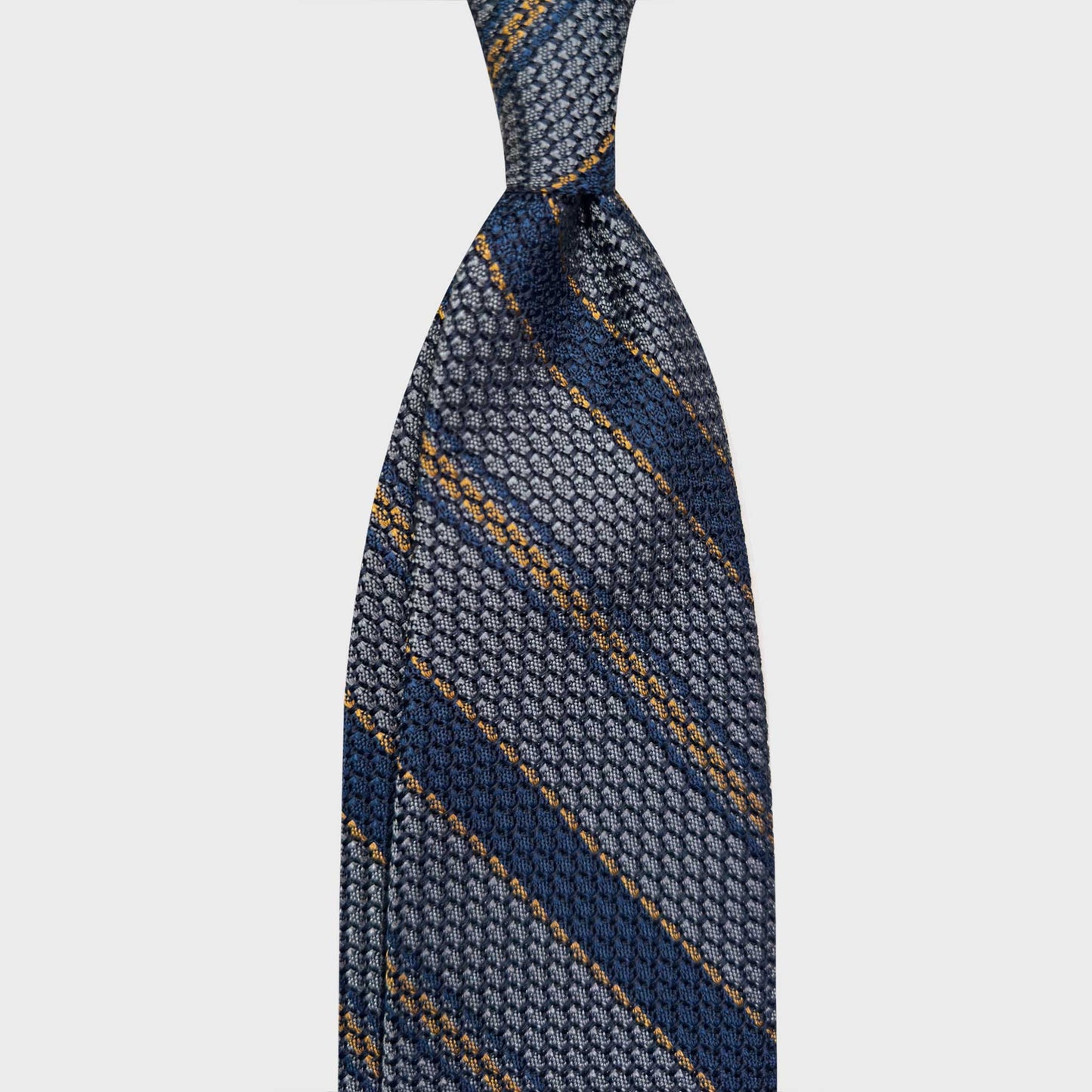 Silver Grey Regimental Silk Tie Grenadine Large Gauze. Classic large gauze grenadine silk tie, hand made striped tie exclusive for men's tie store Wools Boutique Uomo Geneva, silver grey striped regimental ties