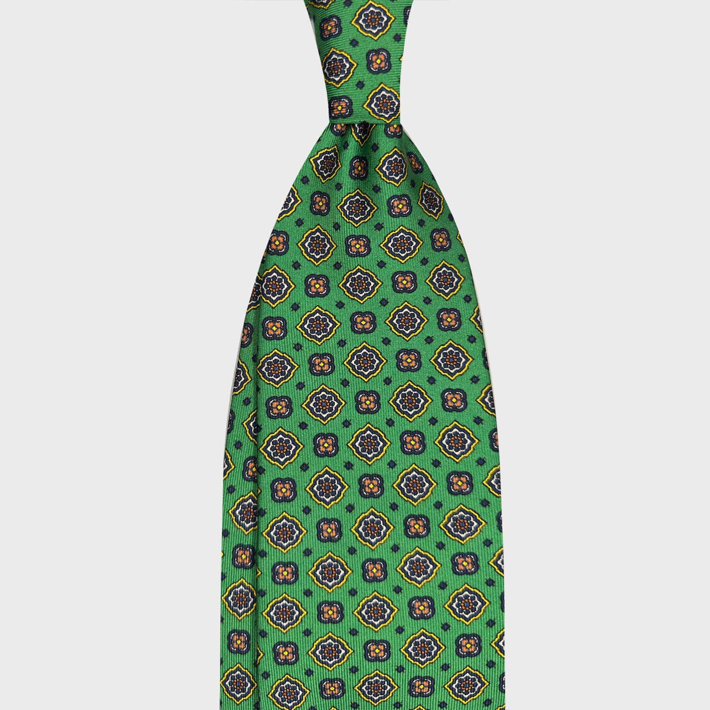 Lime Green Silk Tie Diamonds Pattern Made in Italy. Green silk tie with an elegant diamonds pattern. A refined Italian tie for classic tailoring sophisticated menswear, available at Wools Boutique Uomo Geneva.
