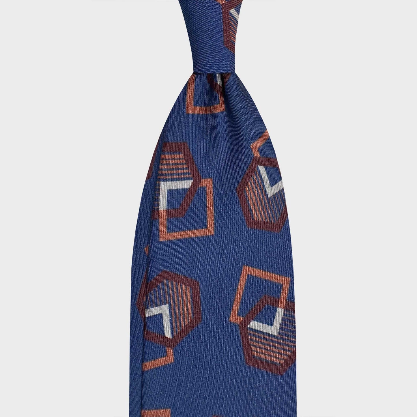 Cobalt Blue Silk Tie Art Deco Bold Geometric Pattern. Cobalt blue silk tie featuring an Art Deco geometric motif in coffee brown and cinnamon tones. Handmade in Italy with distinctive sartorial character.