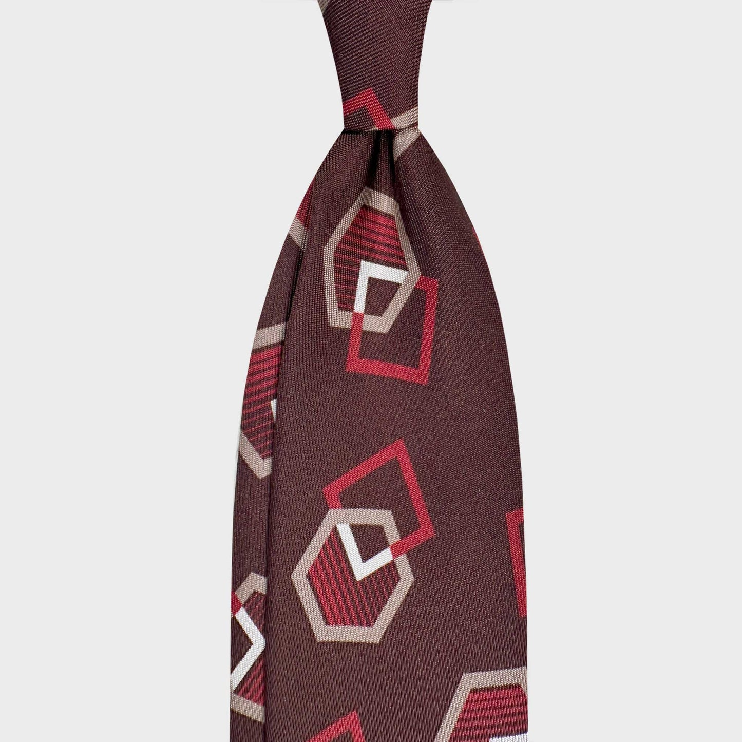 Coffee Brown Silk Tie Art Deco Bold Geometric Pattern. Coffee brown silk tie featuring an Art Deco geometric motif in red and beige tones. Handmade in Italy with distinctive sartorial character.