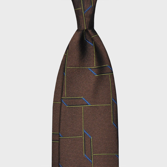 Coffee Brown Partridge Eye Silk Tie 3D Geometric Pattern. Handmade tie with original 3D geometric pattern, made with soft partridge eye silk, unlined hand rolled edge 3 folds, coffee brown background. F.Marino Napoli exclusive handmade in Italy tie for Wools Boutique Uomo