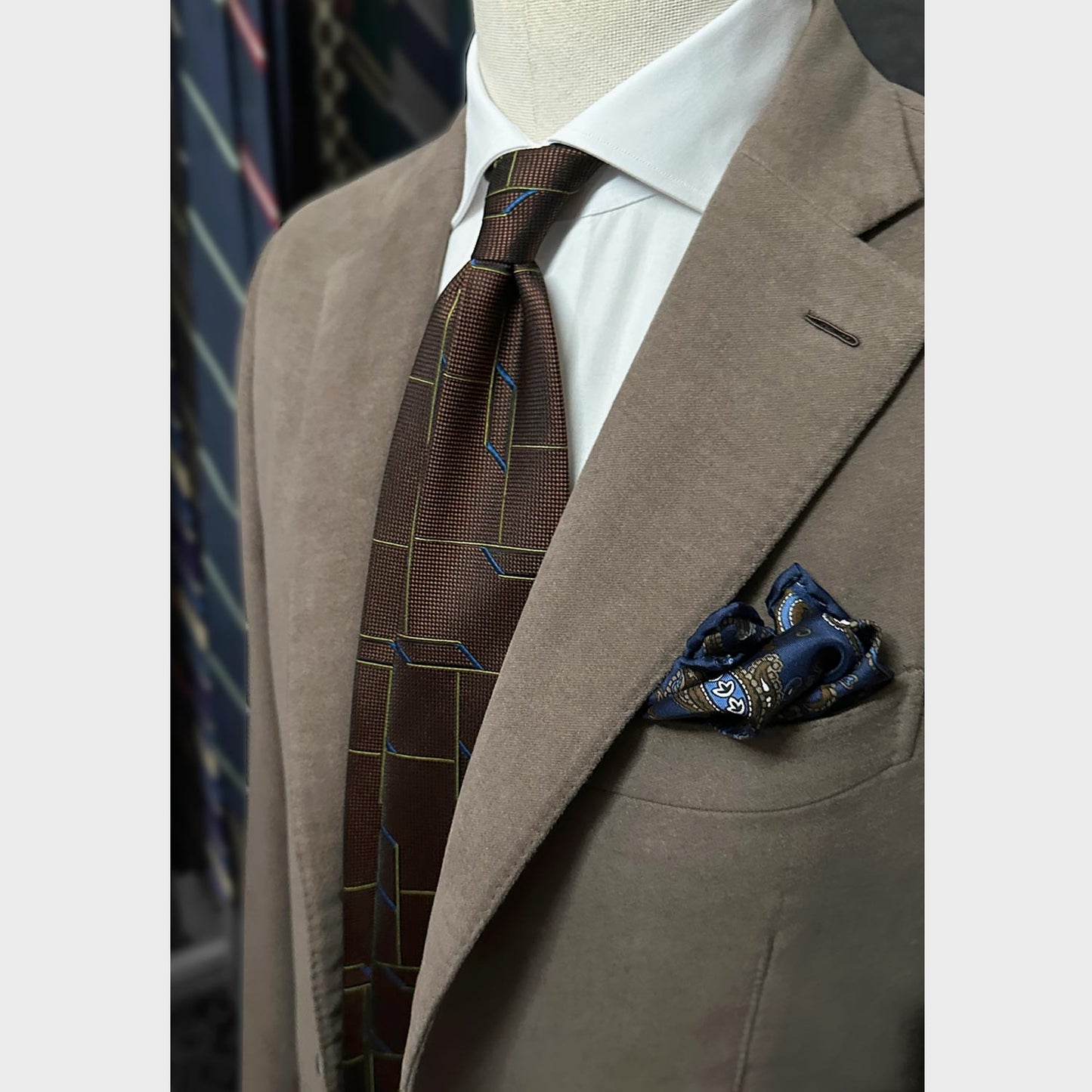 Handmade tie with original 3D geometric pattern, made with soft partridge eye silk, unlined hand rolled edge 3 folds, coffee brown background. F.Marino Napoli exclusive handmade in Italy tie for Wools Boutique Uomo