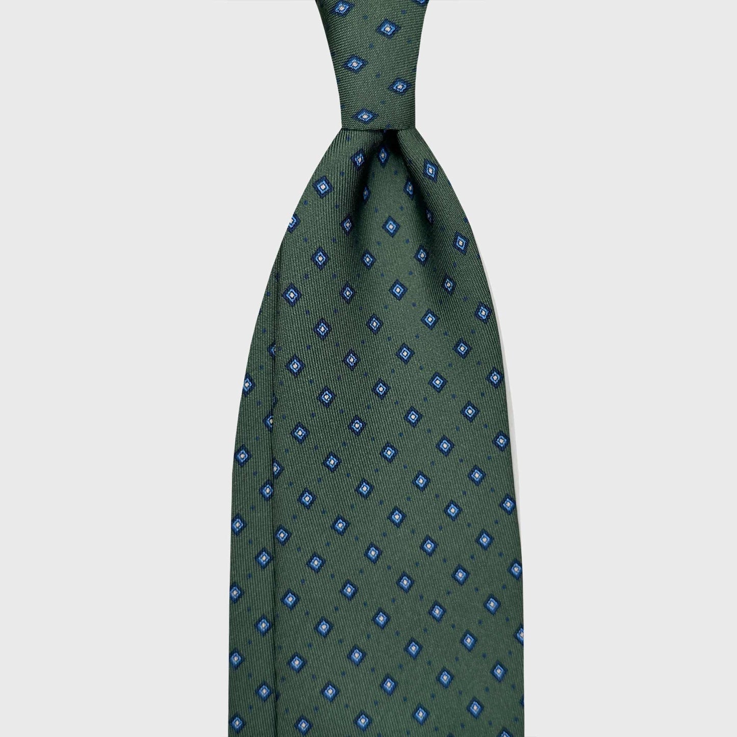 Cactus Green Silk Tie Classic Micro Diamonds Pattern. Silk tie cactus green background, navy blue micro pois, white and navy blue micro diamonds, handmade silk tie F.Marino Napoli for Wools Boutique Uomo Geneva