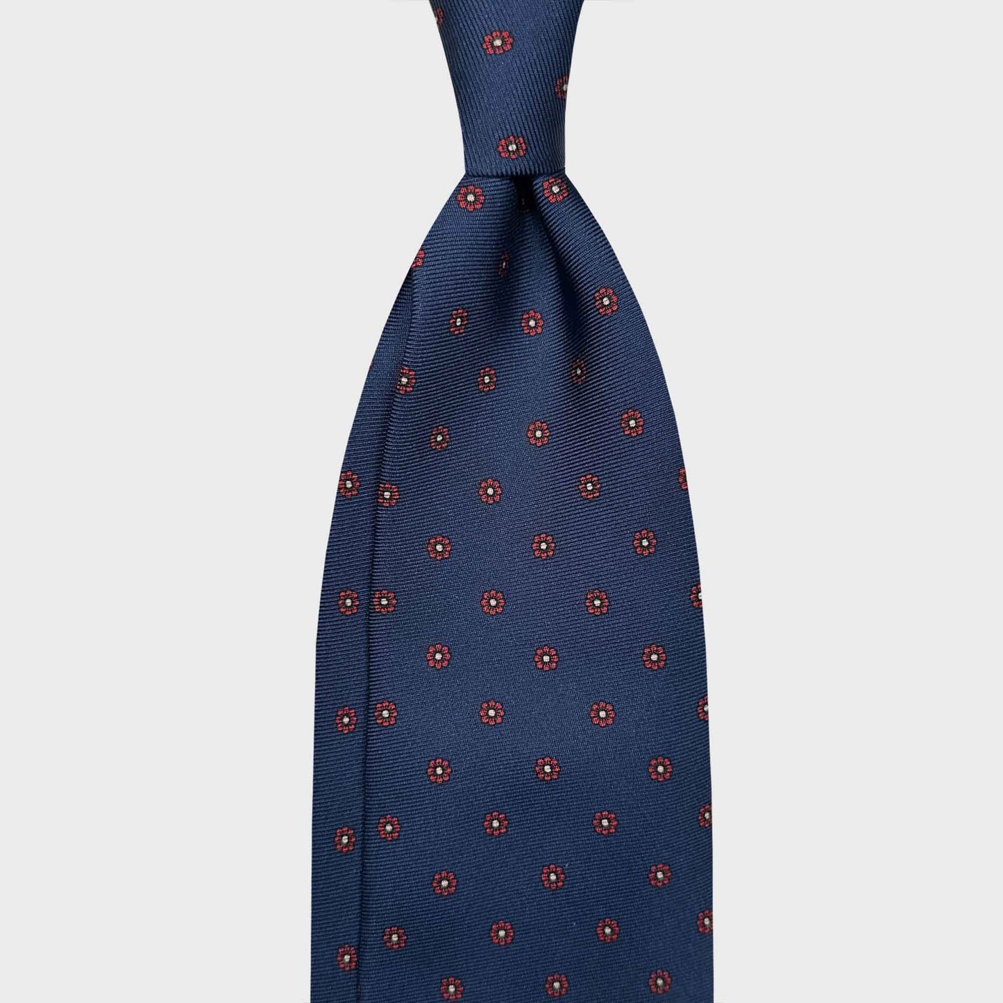 Madder Silk Tie 7 Fold Classic Red Micro Daisy. Handmade silk tie classic pattern, F.Marino Napoli for Wools Boutique Uomo, red micro daisy madder pattern, blue seven fold ties Geneva