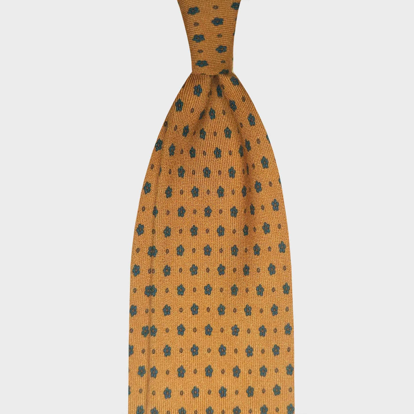 Ocra Yellow Wool Tie Micro Flowers Classic Pattern. Refined yellow tie made in Italy with light wool extra fine, discover collection of classic ties for every seasons at the men's tie shop in Geneva