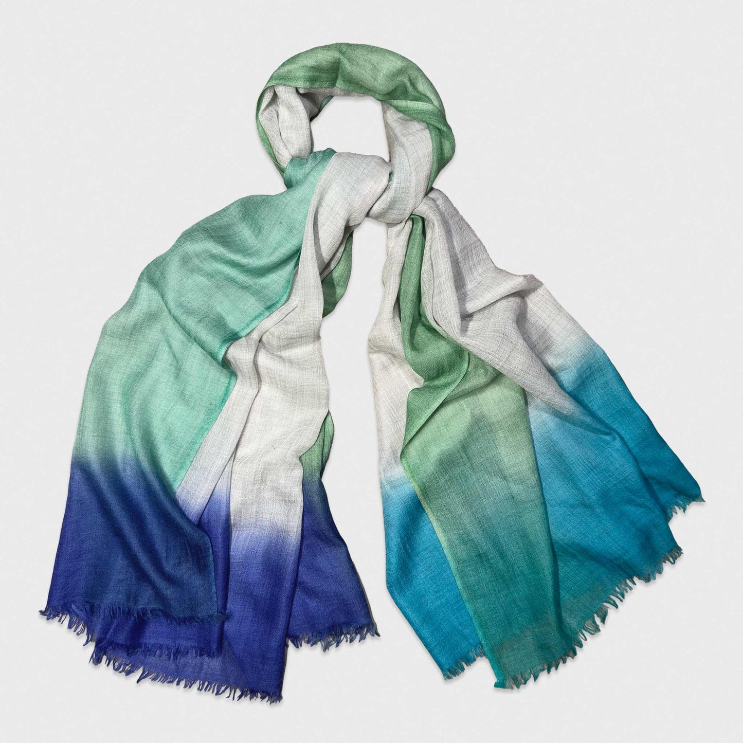 Faliero Sarti 100% cashmere scarf featuring a refined color border design in teal green, cobalt blue and lime framing an ivory center. Lightweight Italian scarf. Made in Italy.