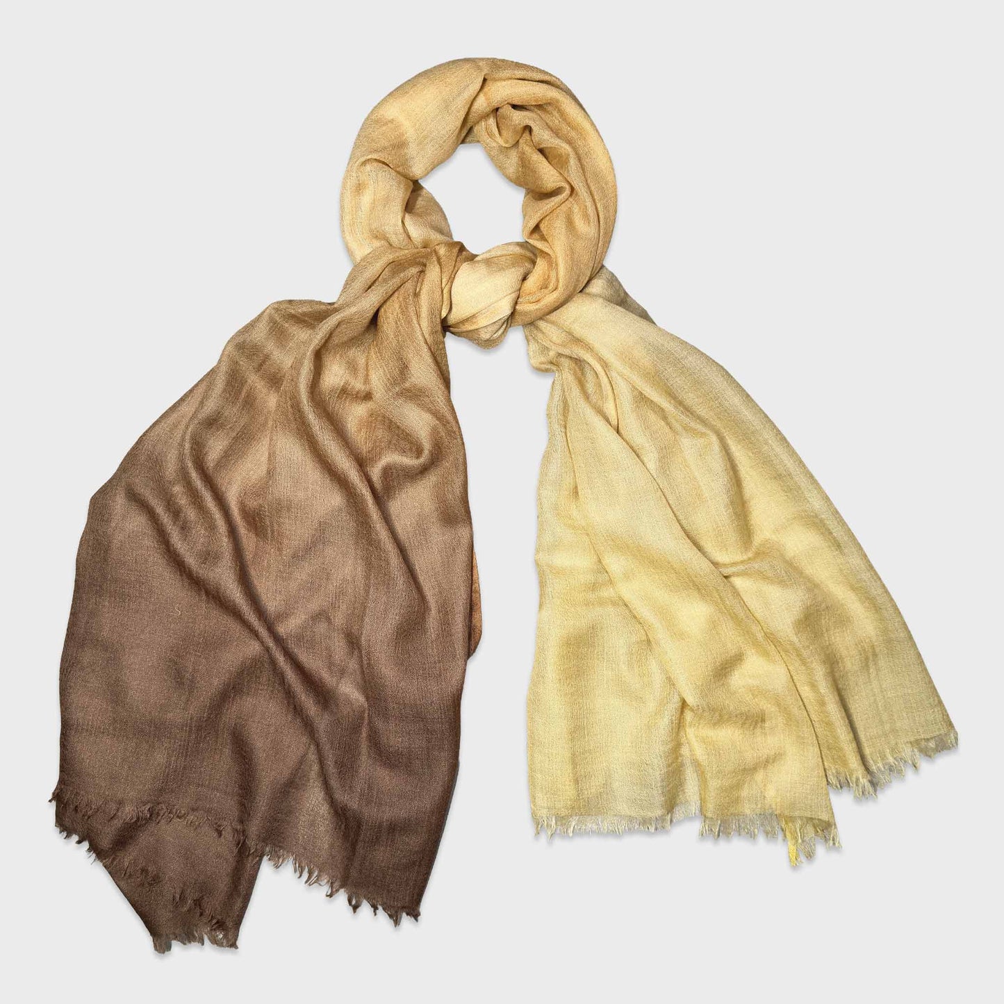 Faliero Sarti 100% cashmere scarf featuring an elegant brown to golden yellow gradient. Lightweight Italian cashmere scarf with refined unisex styling. Made in Italy.