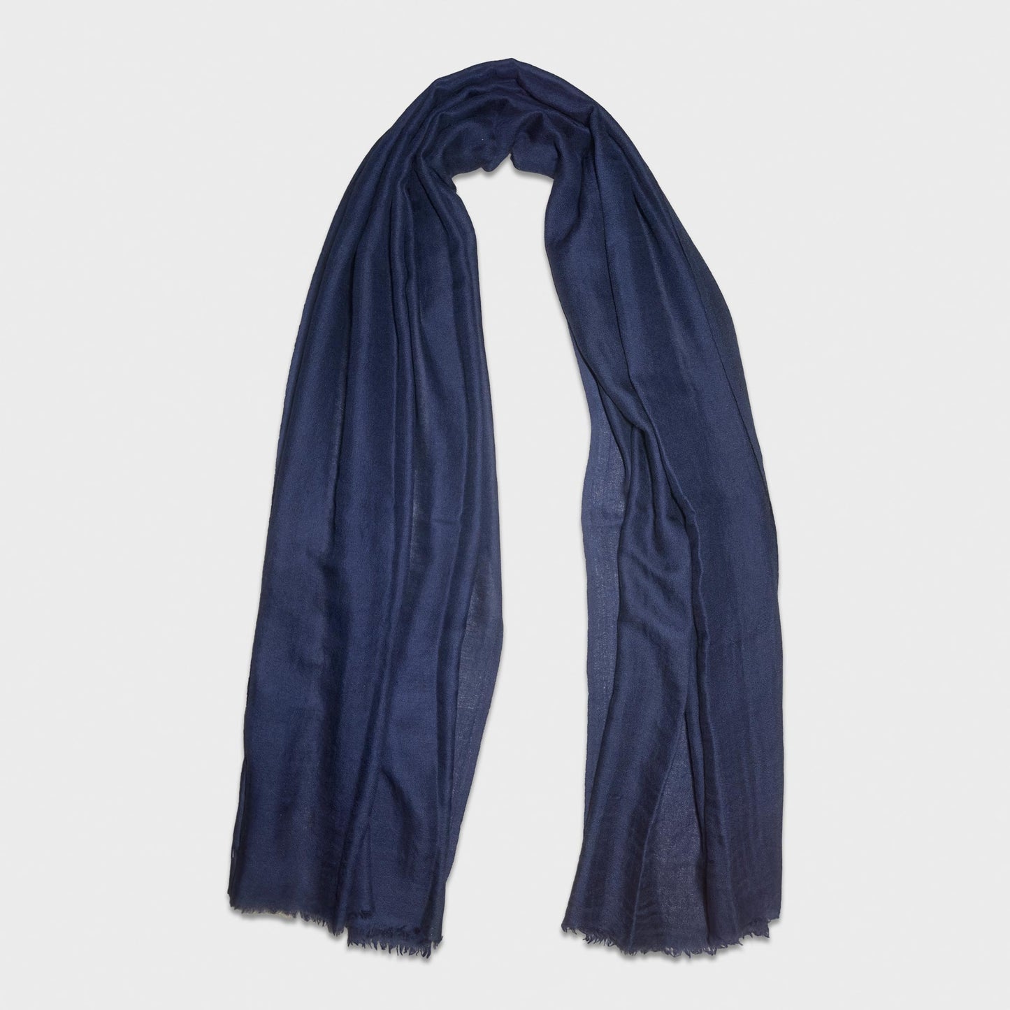Timeless unisex blue cashmere scarf in Geneva, made in Italy by Faliero Sarti, medium comfortable size, soft and warm cashmere, ideal for any season.